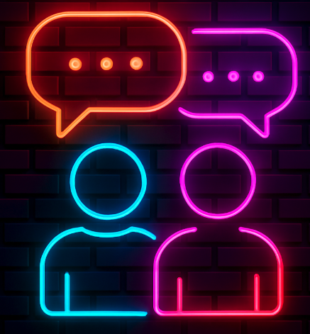 Neon outline of two people with speech bubbles above their heads, one orange and one purple.