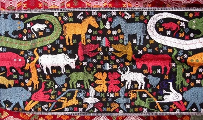 Traditional Vietnamese embroidered textile featuring colorful animals, geometric motifs, and ornamental patterns.