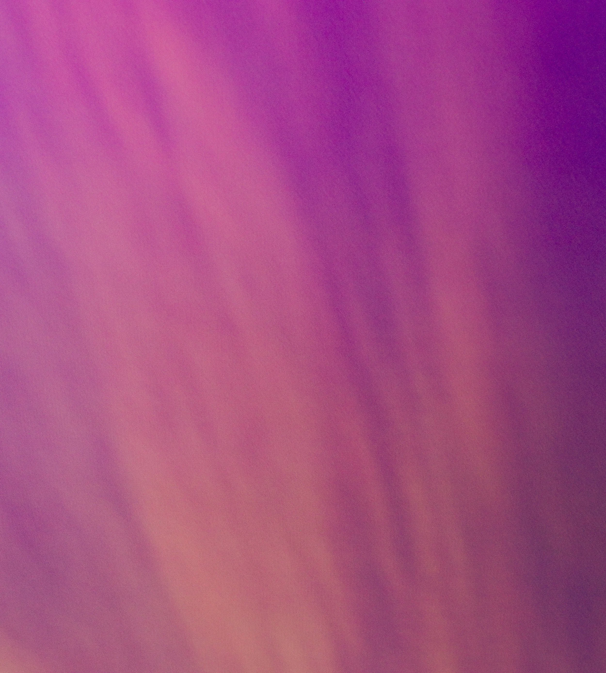 A gradient background transitioning from pink to purple.