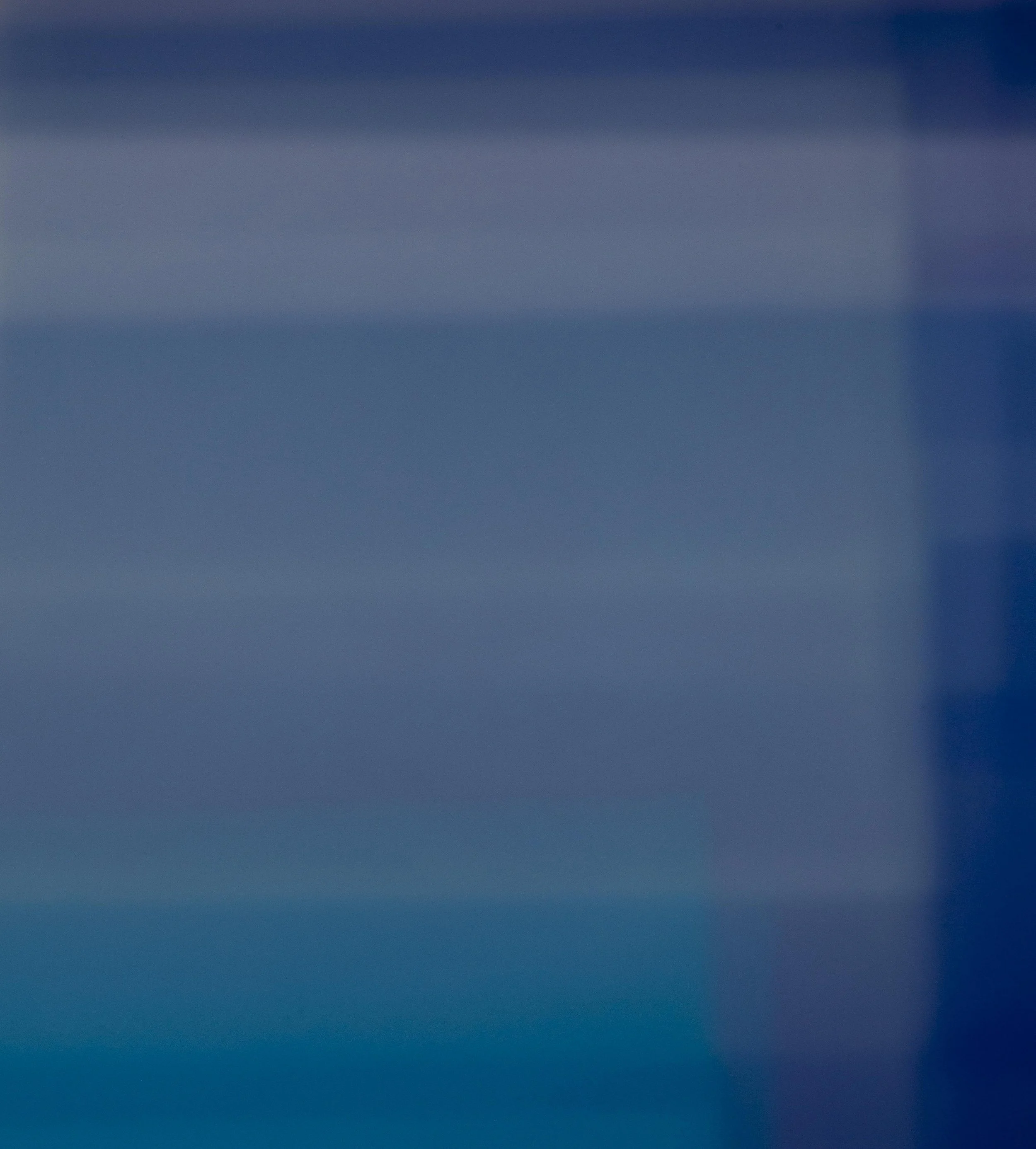 Blue gradient background with no distinguishable objects or features.
