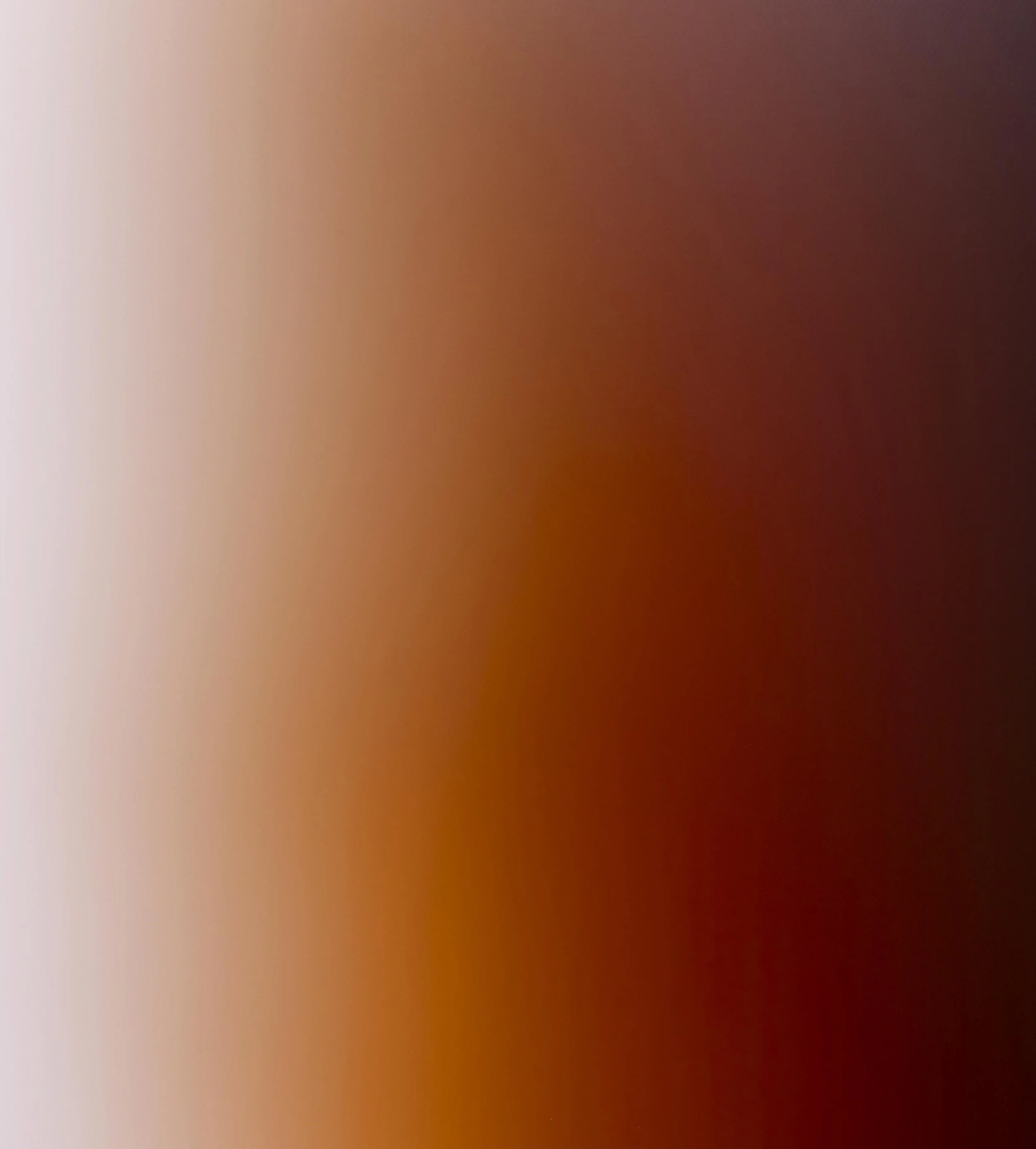 Abstract gradient with soft pink, orange, and dark red hues blending together.