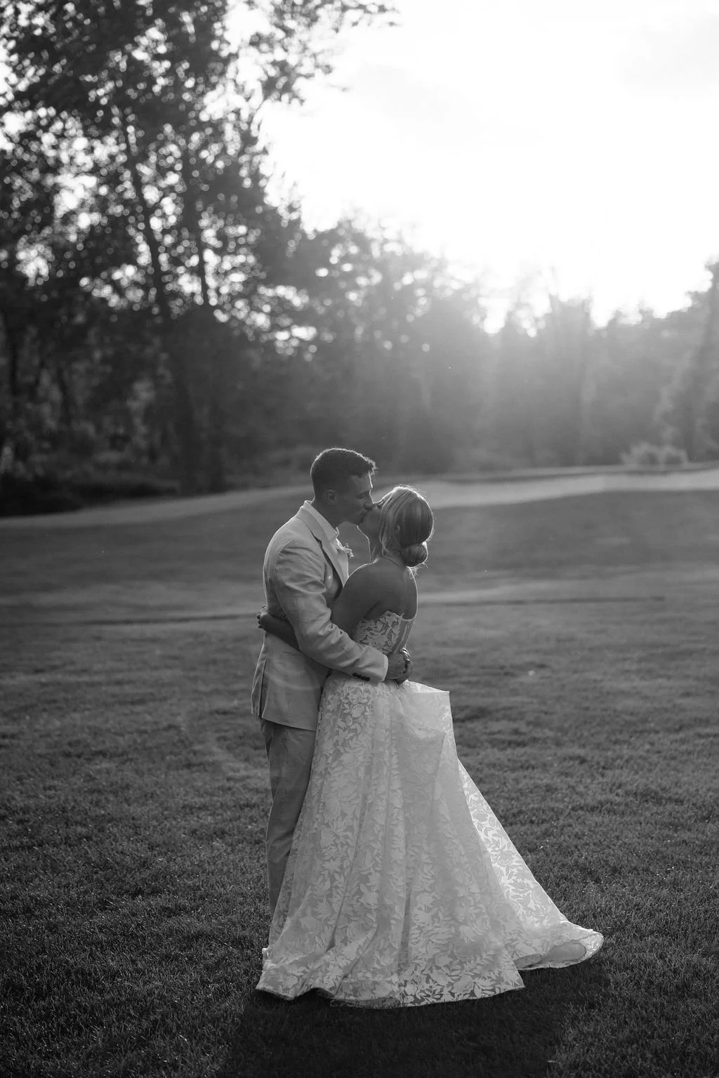 Bride and Groom Under String Lights at Night.jpg