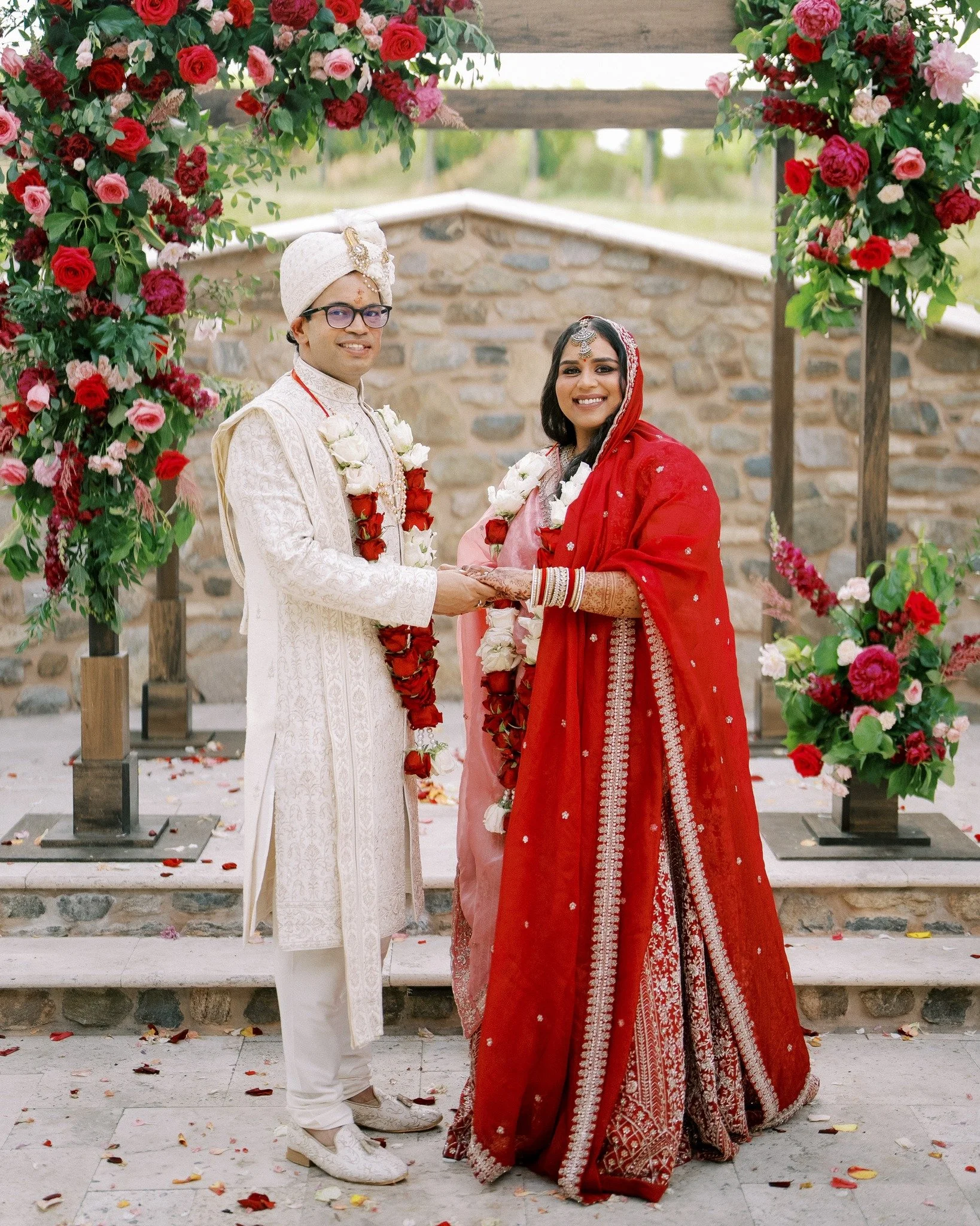 Bright pinks, rich reds, and berry hues &mdash; colors deeply rooted in tradition &mdash; anchor this wedding and set the tone for the day. Reflecting both heritage and modern design, meaningful ceremony rituals honored both families, creating a seam
