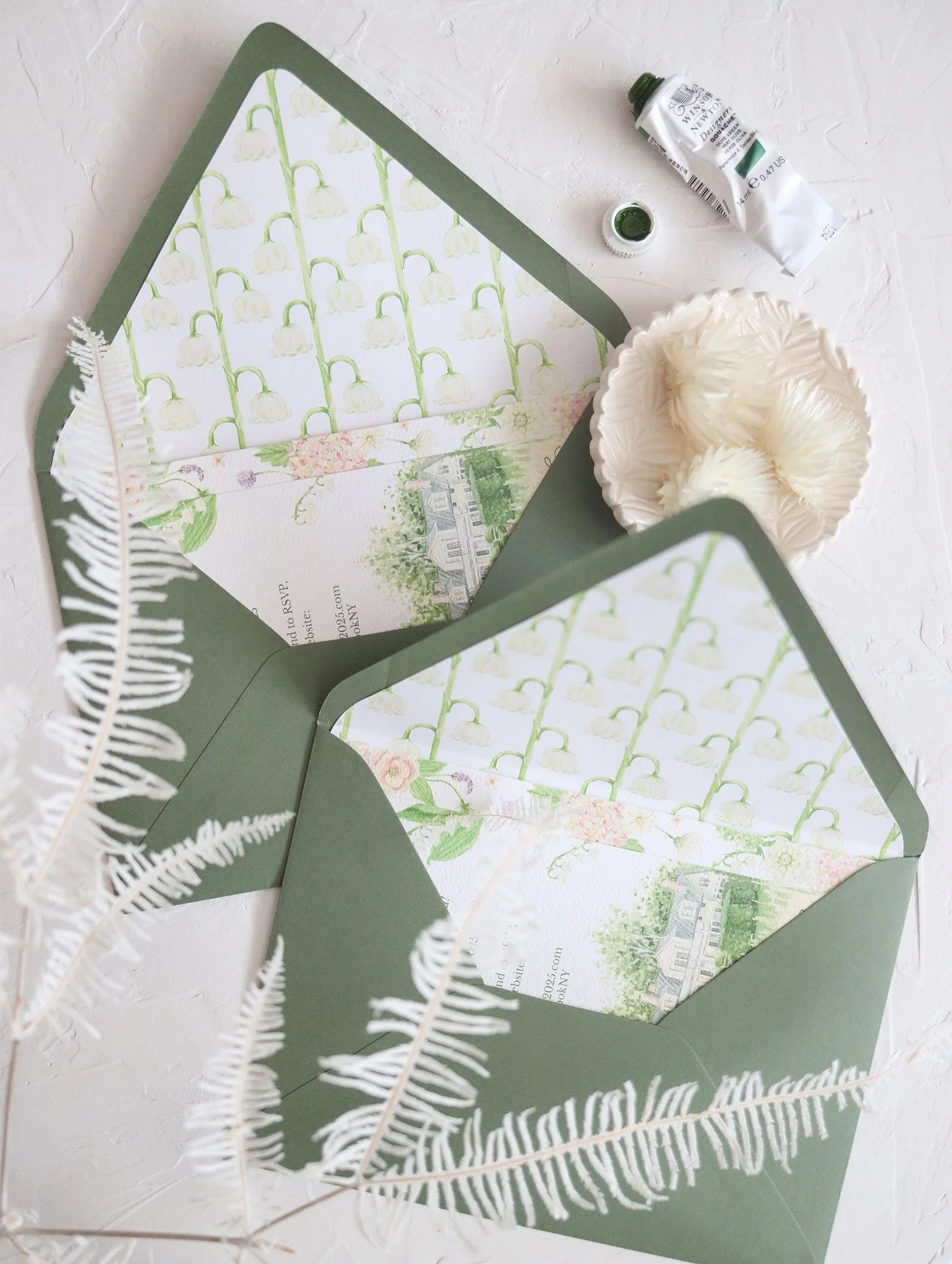 You might recognize this lily of the valley pattern we teased you with a few months ago. Swipe to see the creative way we utilized this motif throughout Charlotte and Chris&rsquo;s wedding day. 

There&rsquo;s bar signs, table numbers and a new offer