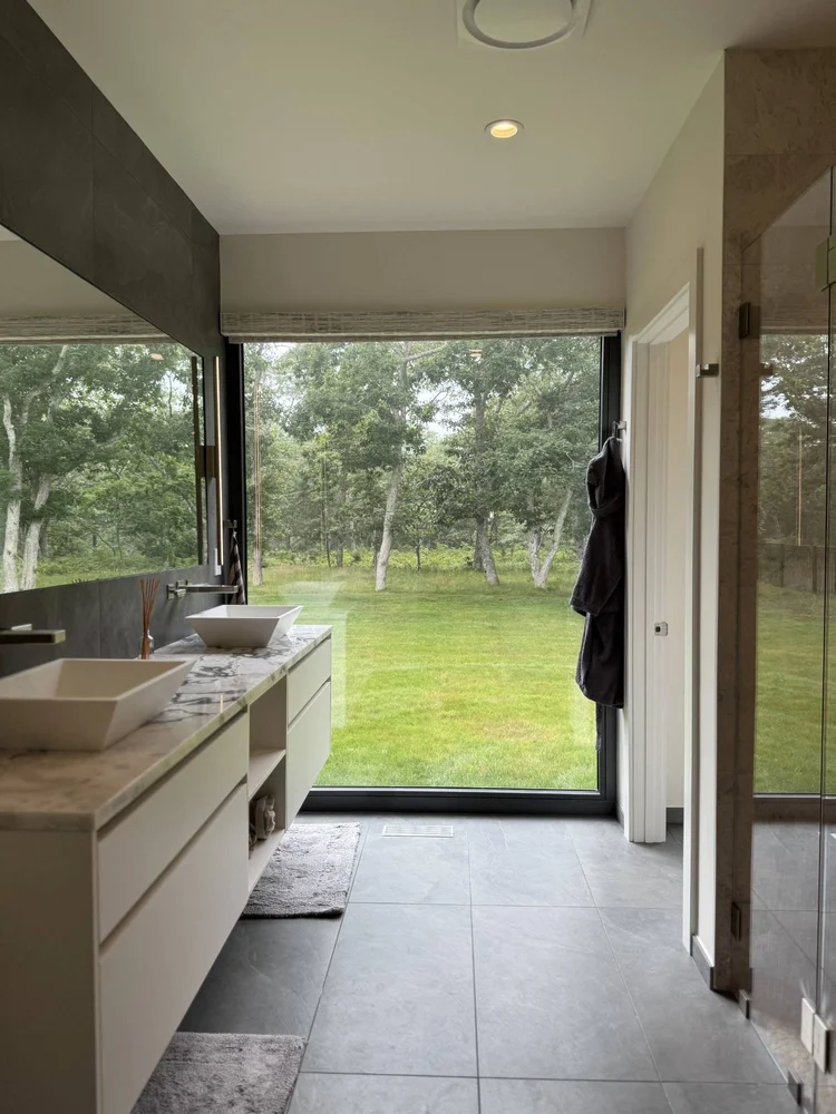 Vanity facing a floor-to-ceiling window