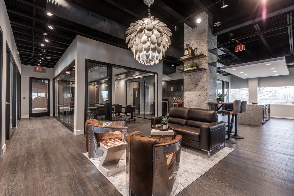 Central office lounge under a sculptural pendant light