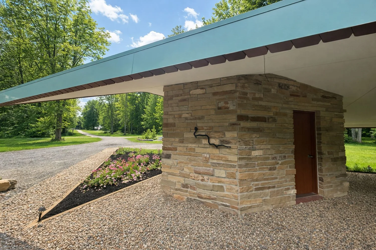 Carport with stone pier and cantilevered roof
