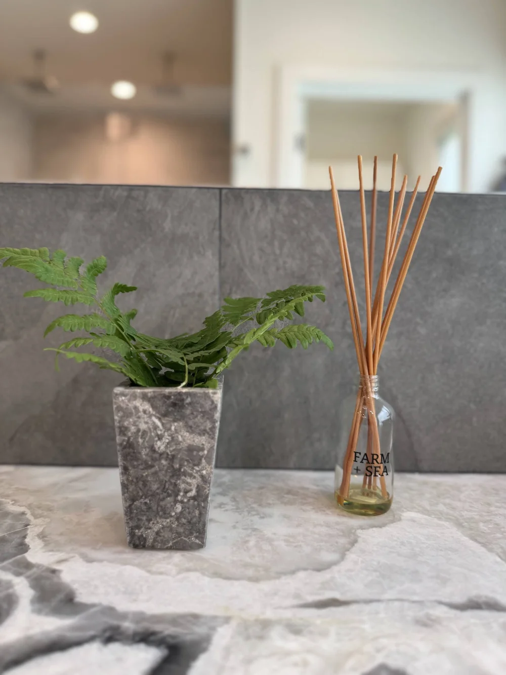 Stone counter with a fern and natural accents