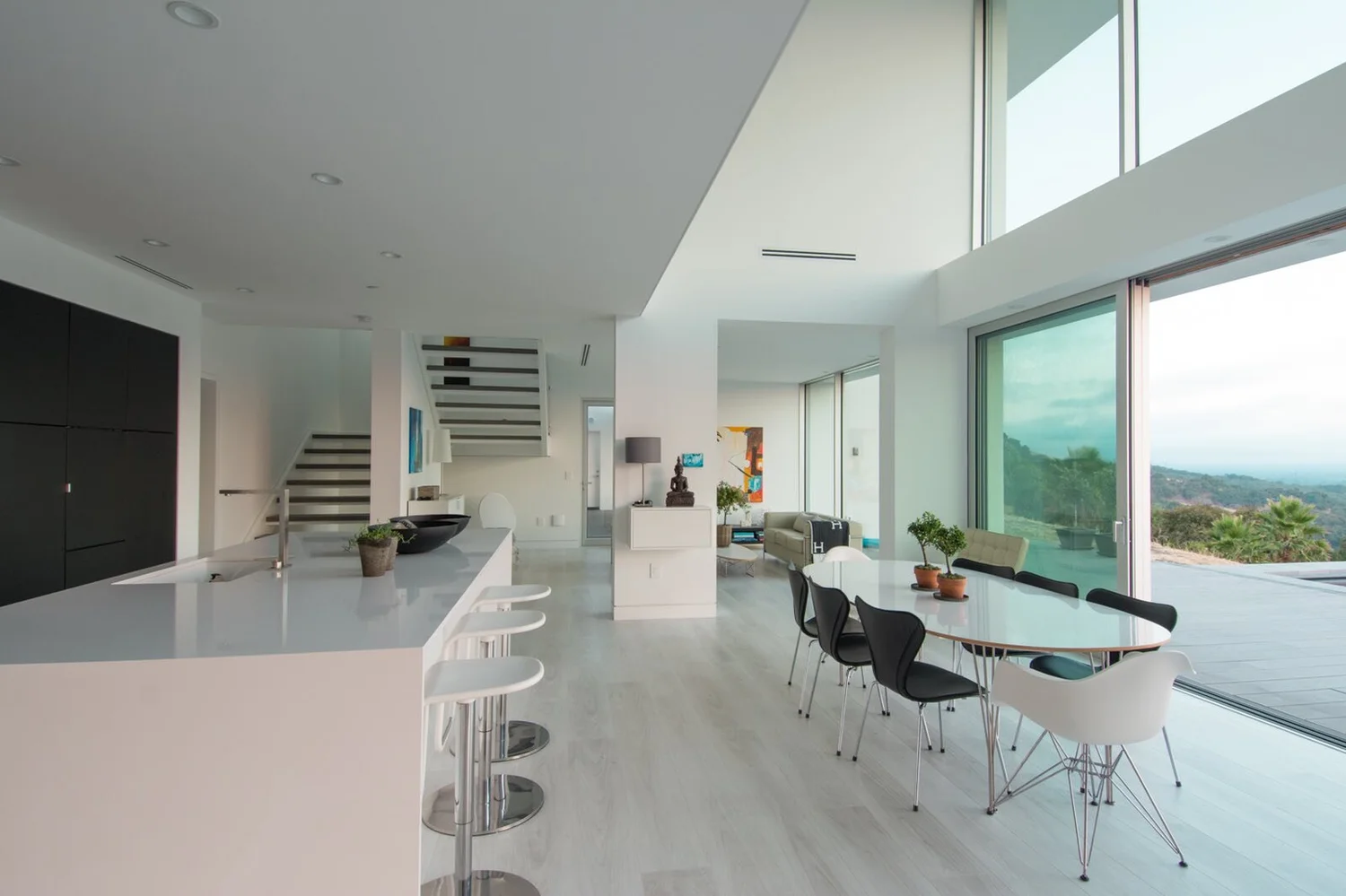 Kitchen and dining under a double-height space