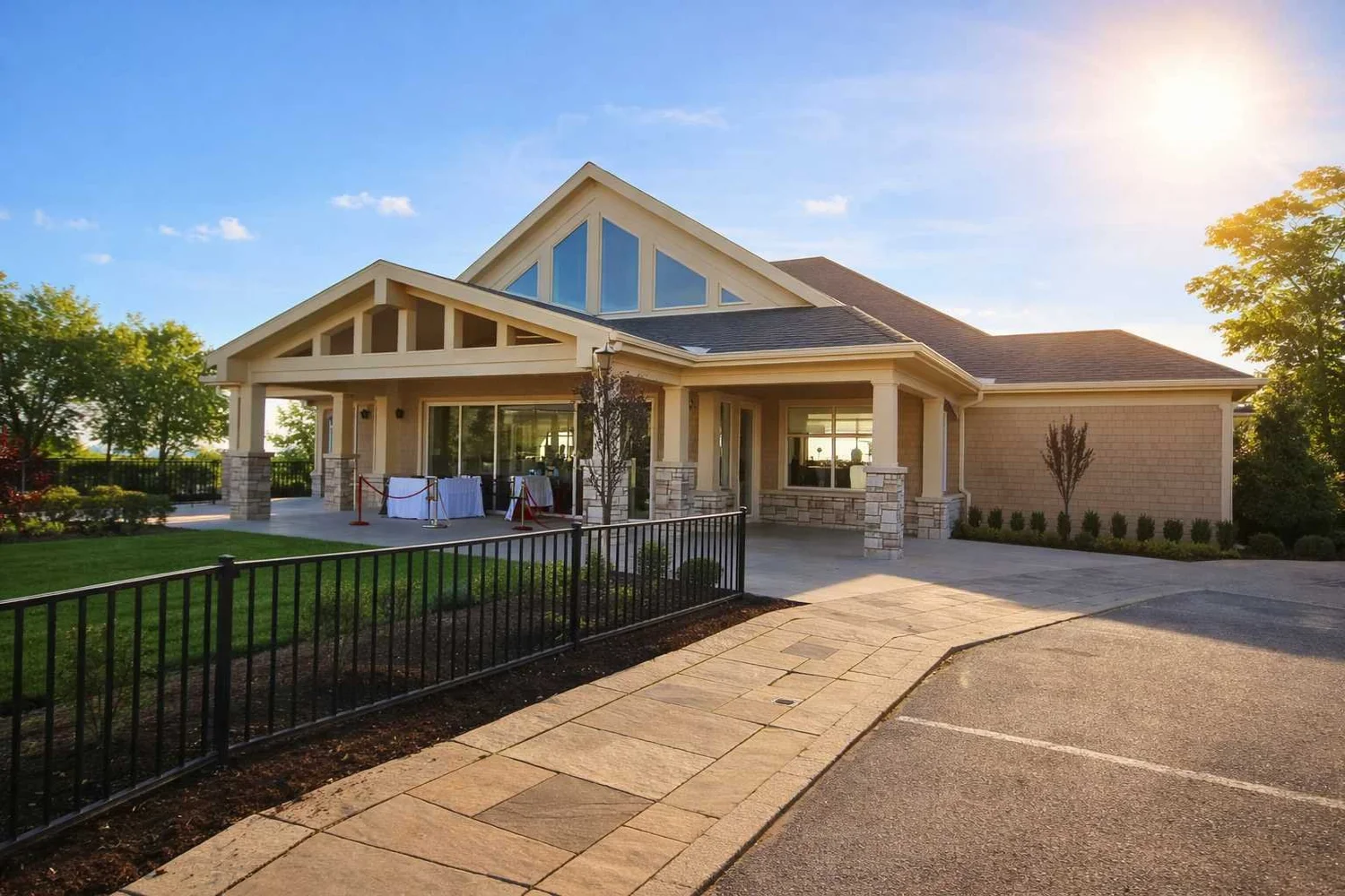 The Sunset Pavilion at Shoreby Club with a broad gabled roof, tall glazed gable and covered entry terrace