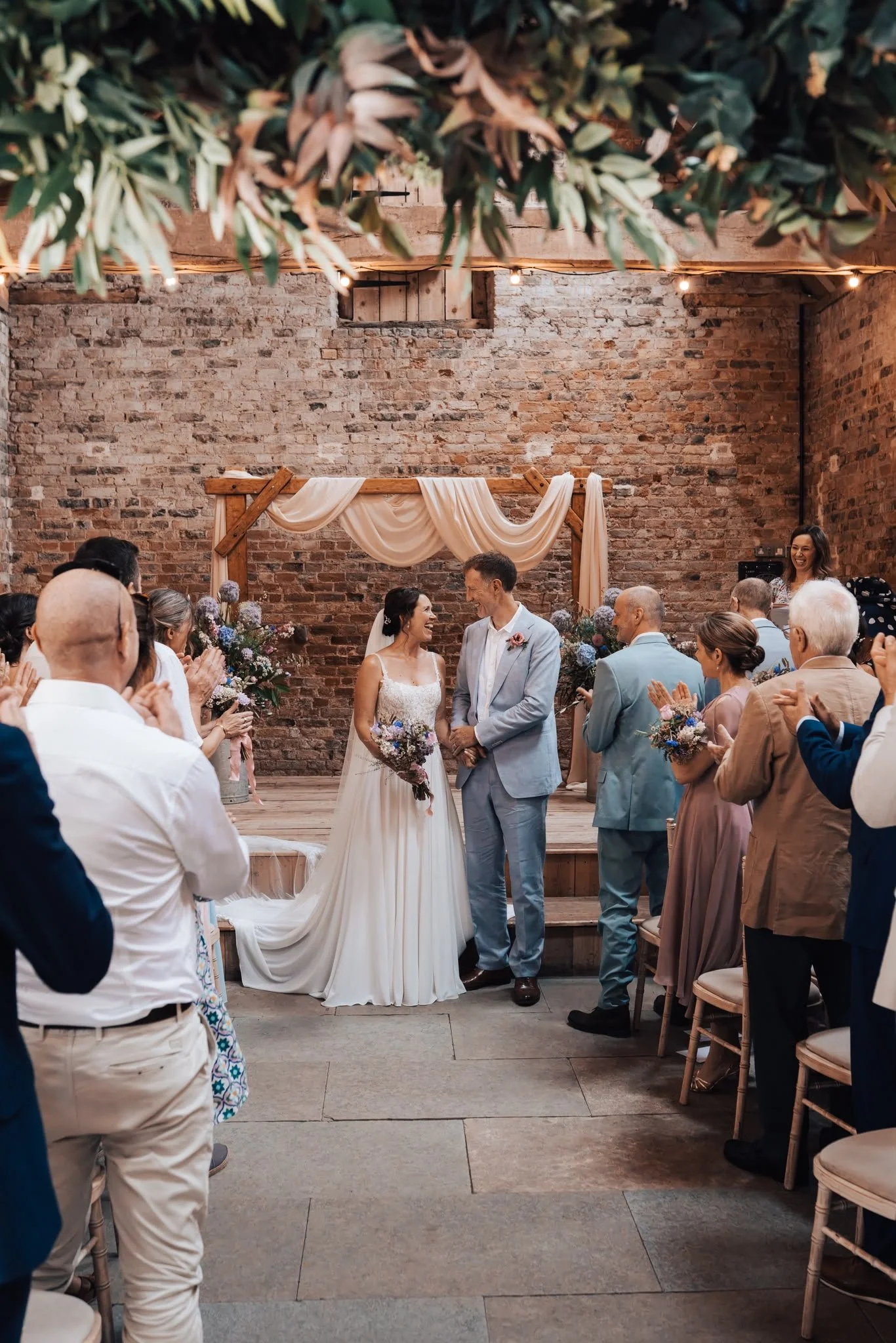 Couple celebrating their wedding ceremony by a wedding celebrant in Surrey. Photo: Paul Cuthbertson