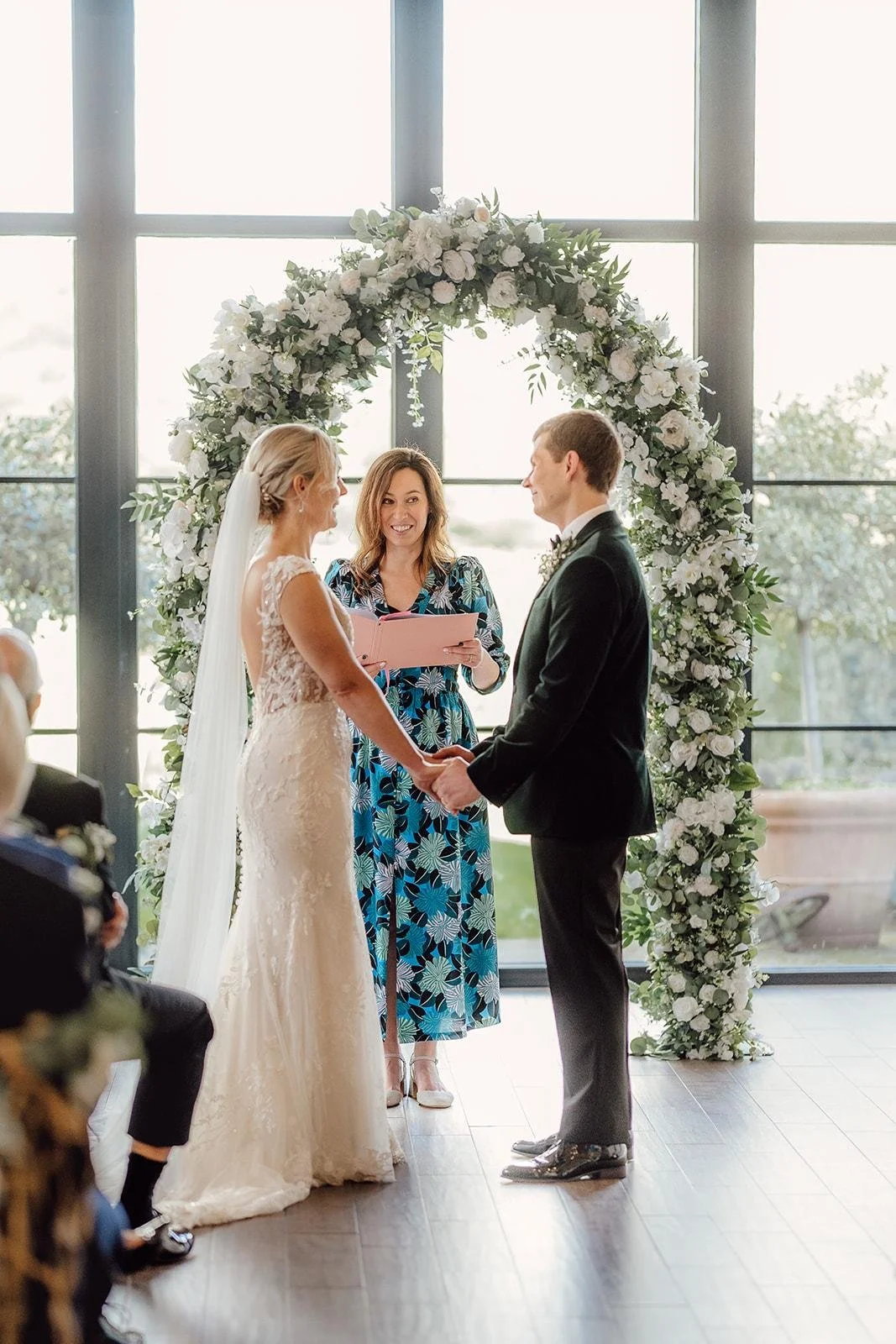 A couple celebrate their wedding ceremony at Lillibrooke Manor in Berkshire, led by an independent Surrey wedding celebrant, creating a relaxed and personalised celebration with family and friends. Photo: Amy Diana Photography