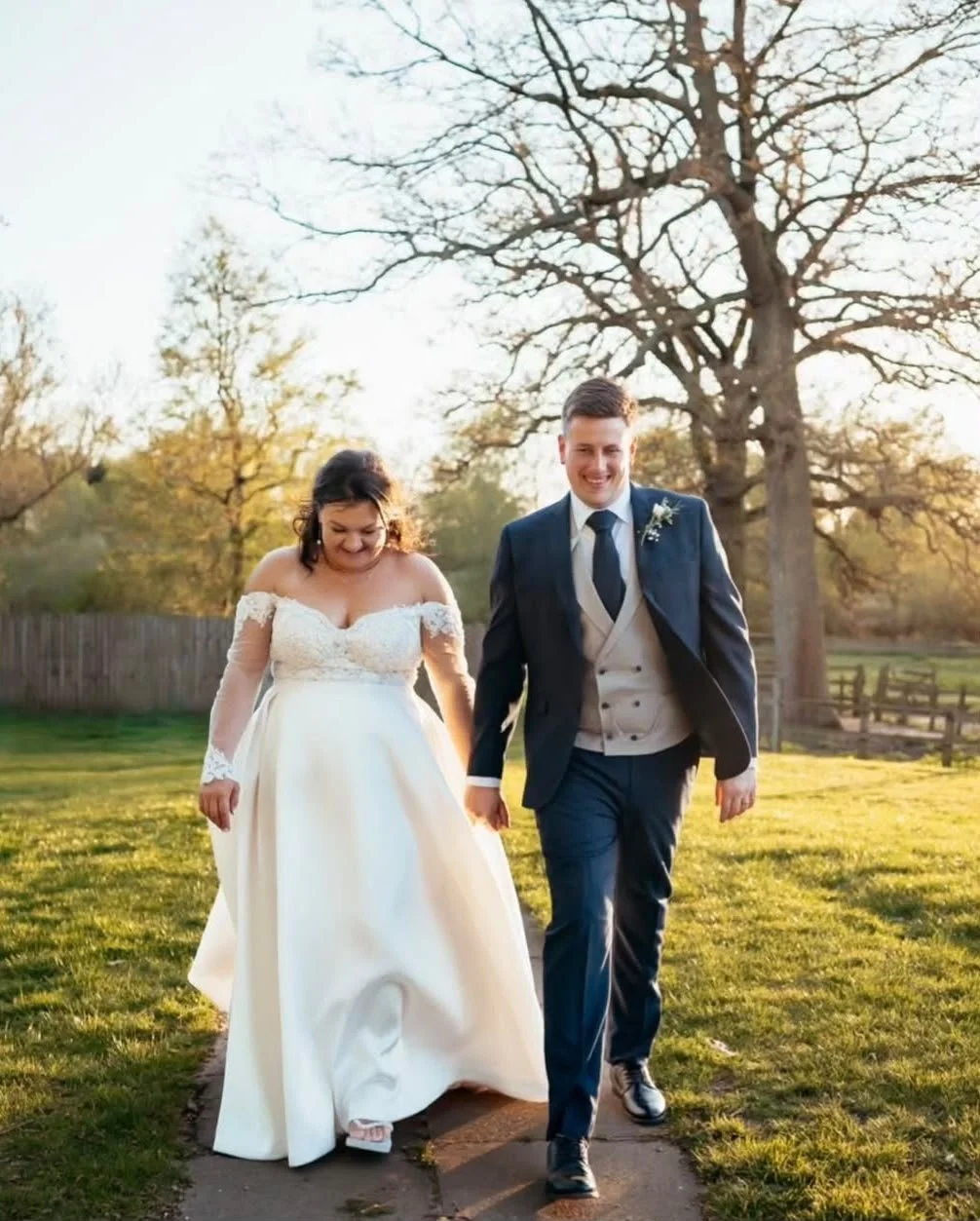 Wedding couple stroll through the gardens at   Mulberry House, wedding venue in Essex golden hour following their ceremony created and delivered by Surrey-based wedding celebrant, Made With Love Celebrations 
Photo: Eyebrow Photography