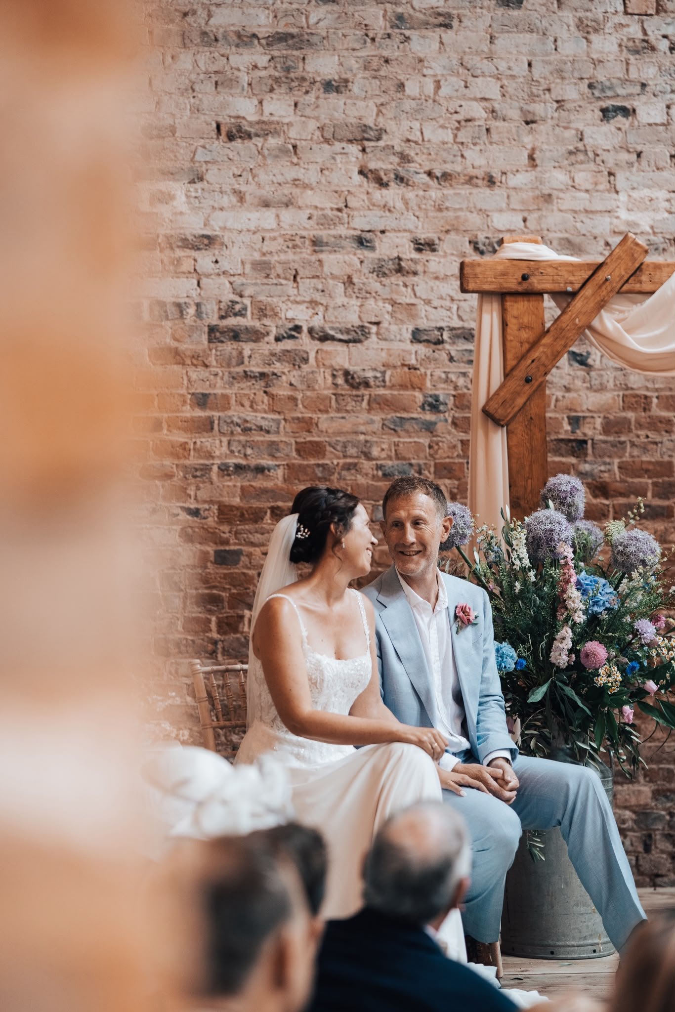 Couple enjoying personalised wedding ceremony created and delivered by Surrey Wedding Celebrant at Milton End Barns, The Cotswolds. Photo: Paul Cuthbertson