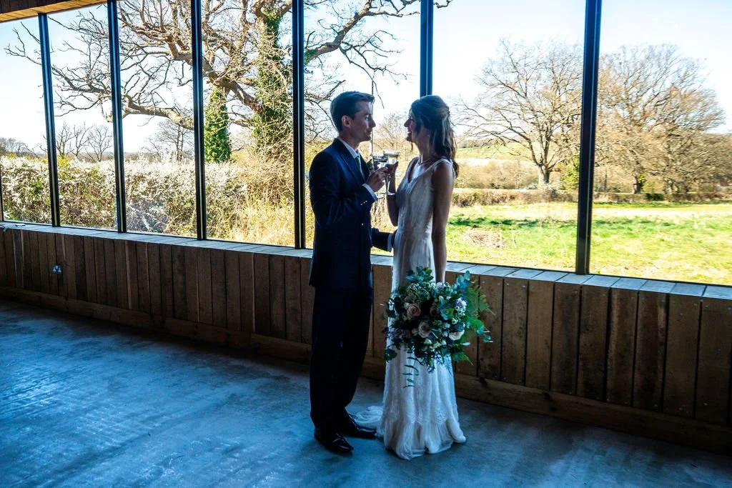 Wedding couple following their celebrant led wedding ceremony at Chafford Park in Kent by Surrey Wedding Celebrant. Photo: Isobel WN Photography