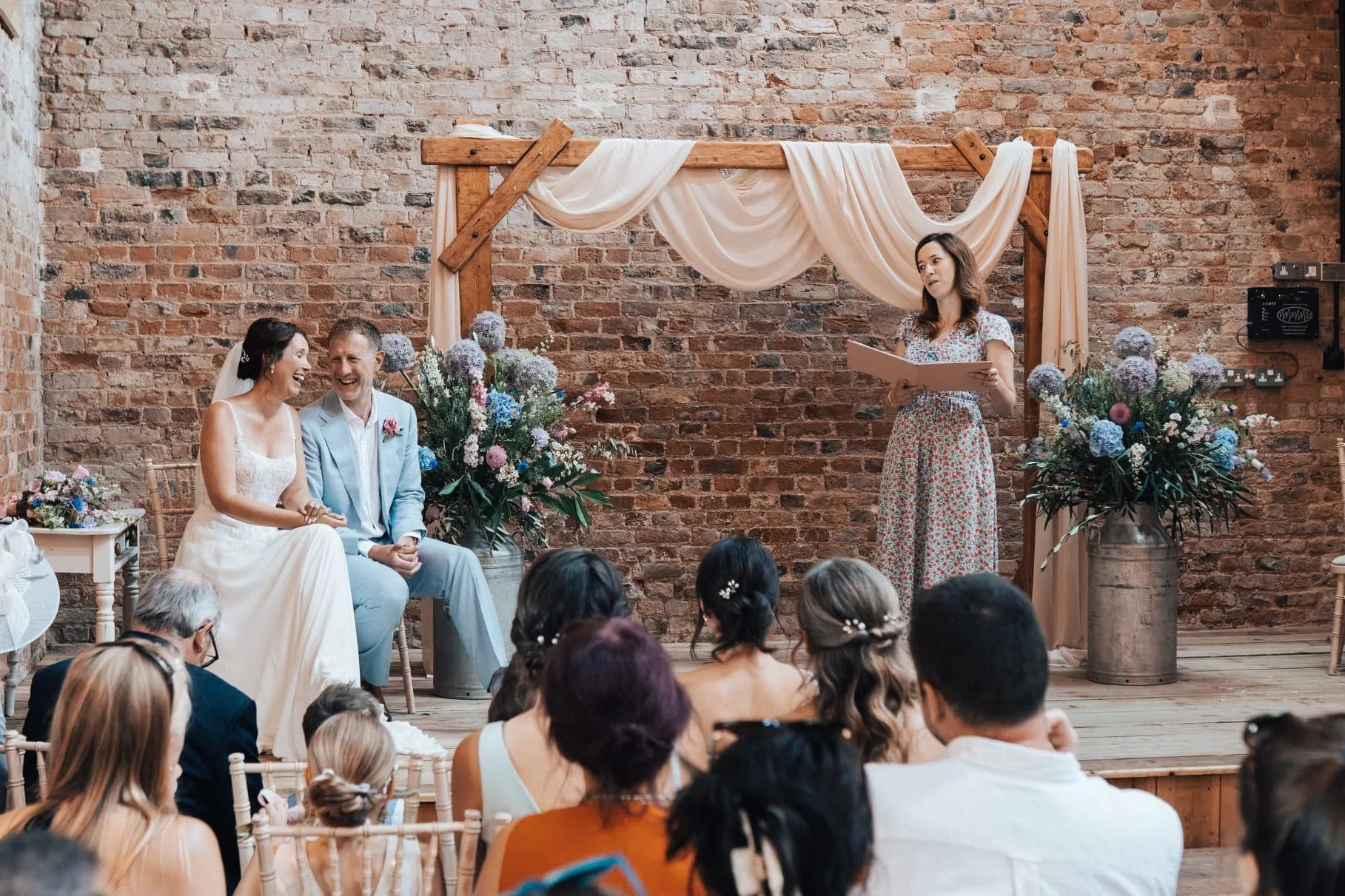 A  beautiful wedding couple celebrate their wedding ceremony delivered by a Surrey based wedding celebrant at Milton End Barns, Gloucestershire. 
Photo: Paul Cuthbertson