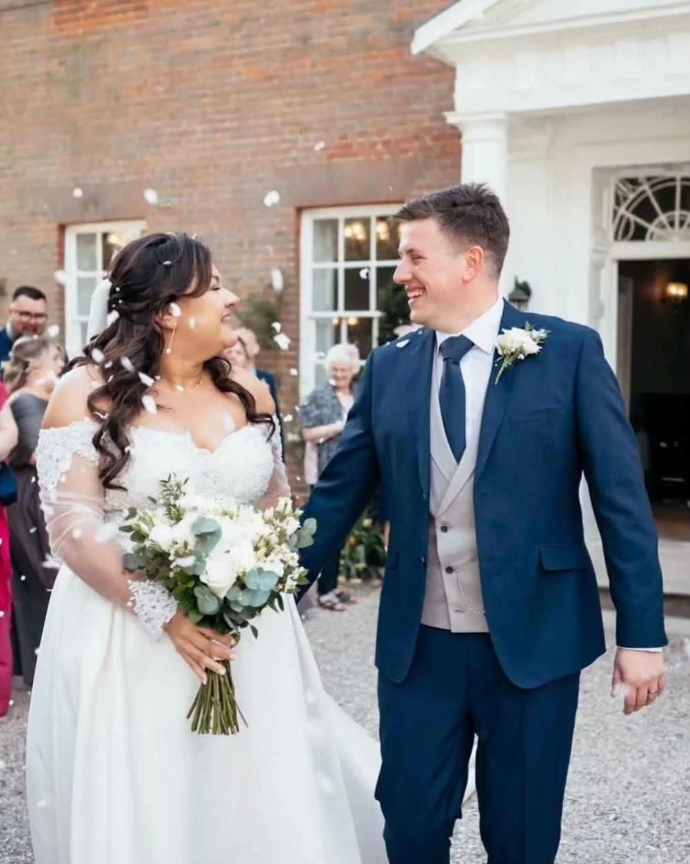 Couple smile at each other following their bespoke wedding ceremony led by Surrey wedding celebrant, Made With Love Celebrations, Photo: Eyebrow Photographyhoto: Eyebrow Photo