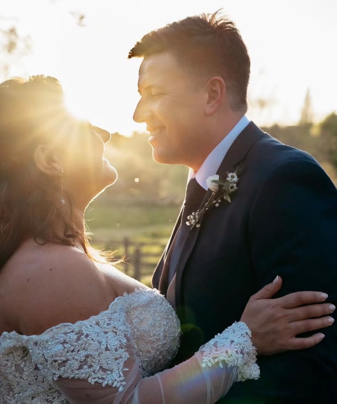 Wedding couple at golden hour following their ceremony created and delivered by Surrey-based wedding celebrant, Made With Love Celebrations at Mulberry House, wedding venue in Essex
Photo: Eyebrow Photography