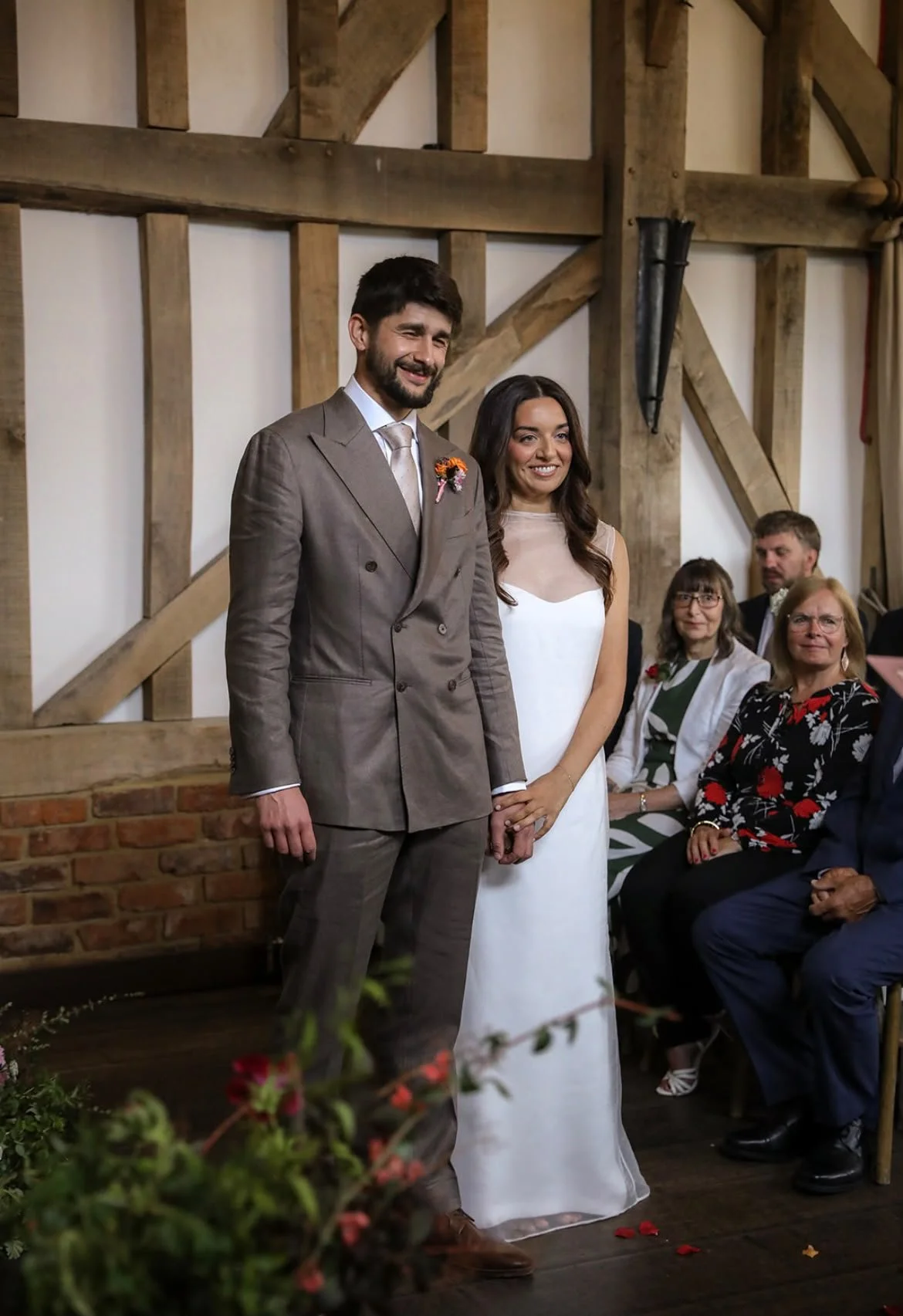 Smiling wedding couple during their personal wedding ceremony at Surrey wedding venue Gate Street Barn created by Surrey Wedding Celebrant: Made With Love Celebrations , Photo: VLA Wedding Photography
