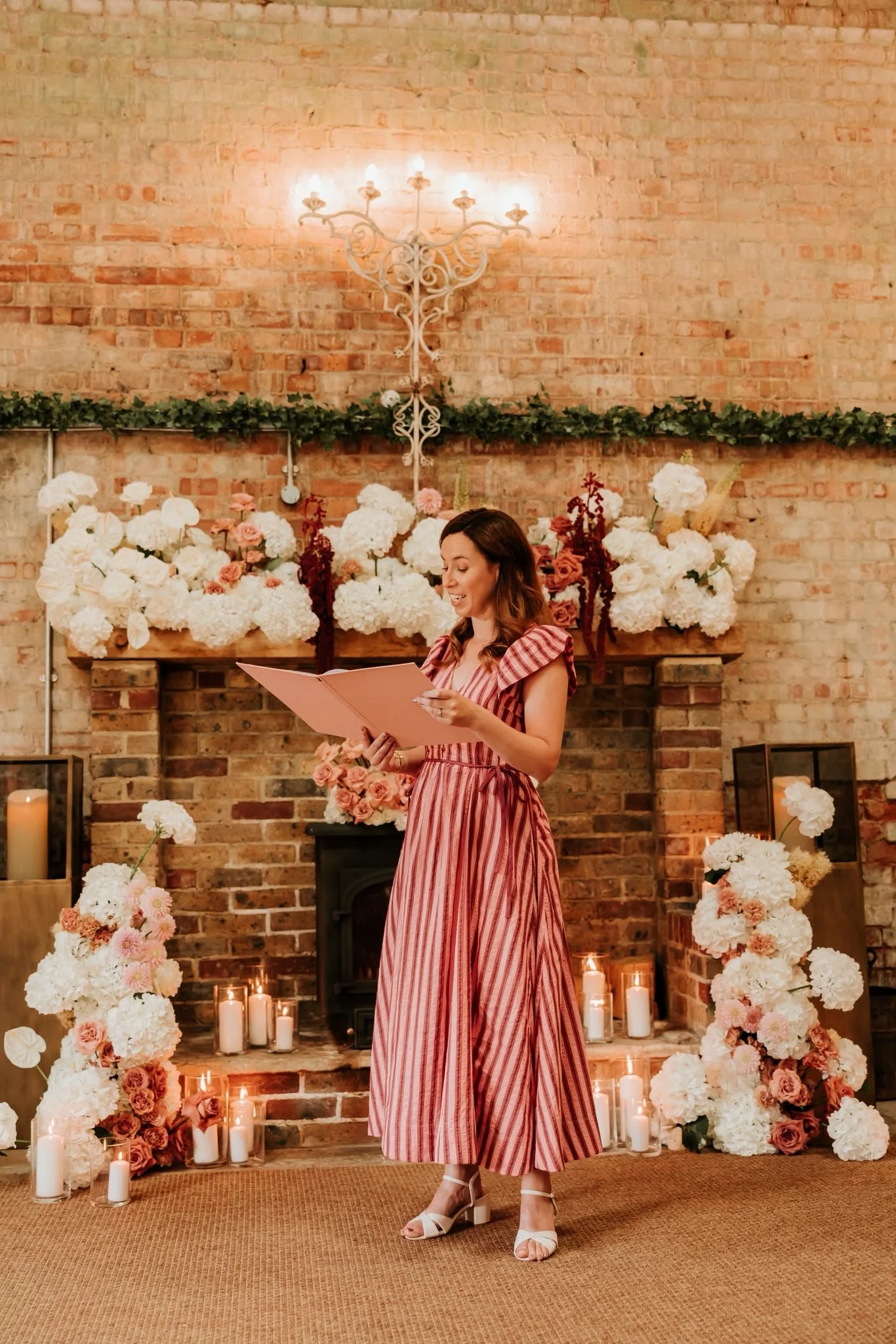 Wedding Celebrant in Surrey delivering a warm and heartfelt wedding ceremony at Surrey wedding venue, The Barn at Botley Hill. Photo: Hannah MacGregor Photo & Film