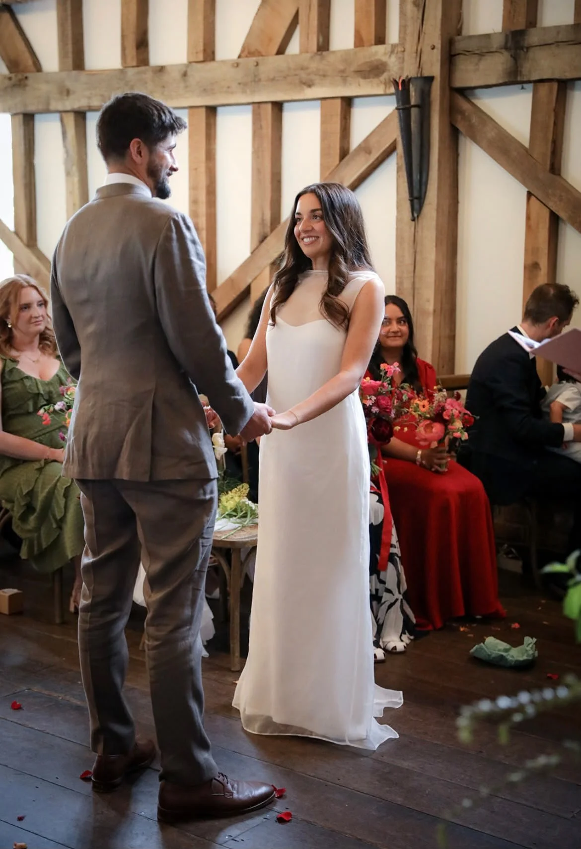 A beautiful wedding couple looking lovingly at each other during their wedding ceremony at Gate Street Barn in Surrey as their independent wedding celebrant led their very personal and heartfelt  wedding ceremony.
Photo: VLA Wedding Photography