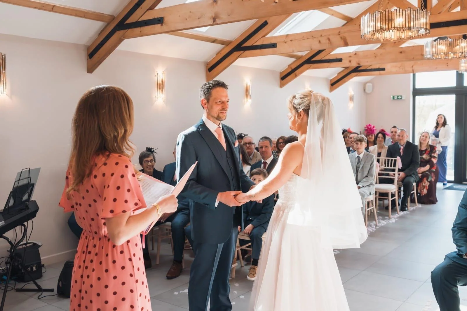 Surrey-based independent wedding celebrant leading a personalised wedding ceremony at Gellifawr Woodland Retreat in Pembrokeshire, creating meaningful celebrations in a stunning woodland venue. Photo: Browne & Dixon Photography