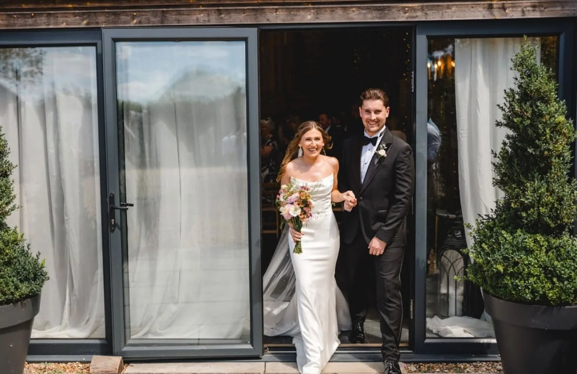 Happy couple exiting their celebrant-led wedding by Surrey wedding celebrant. Photo: Parkershots