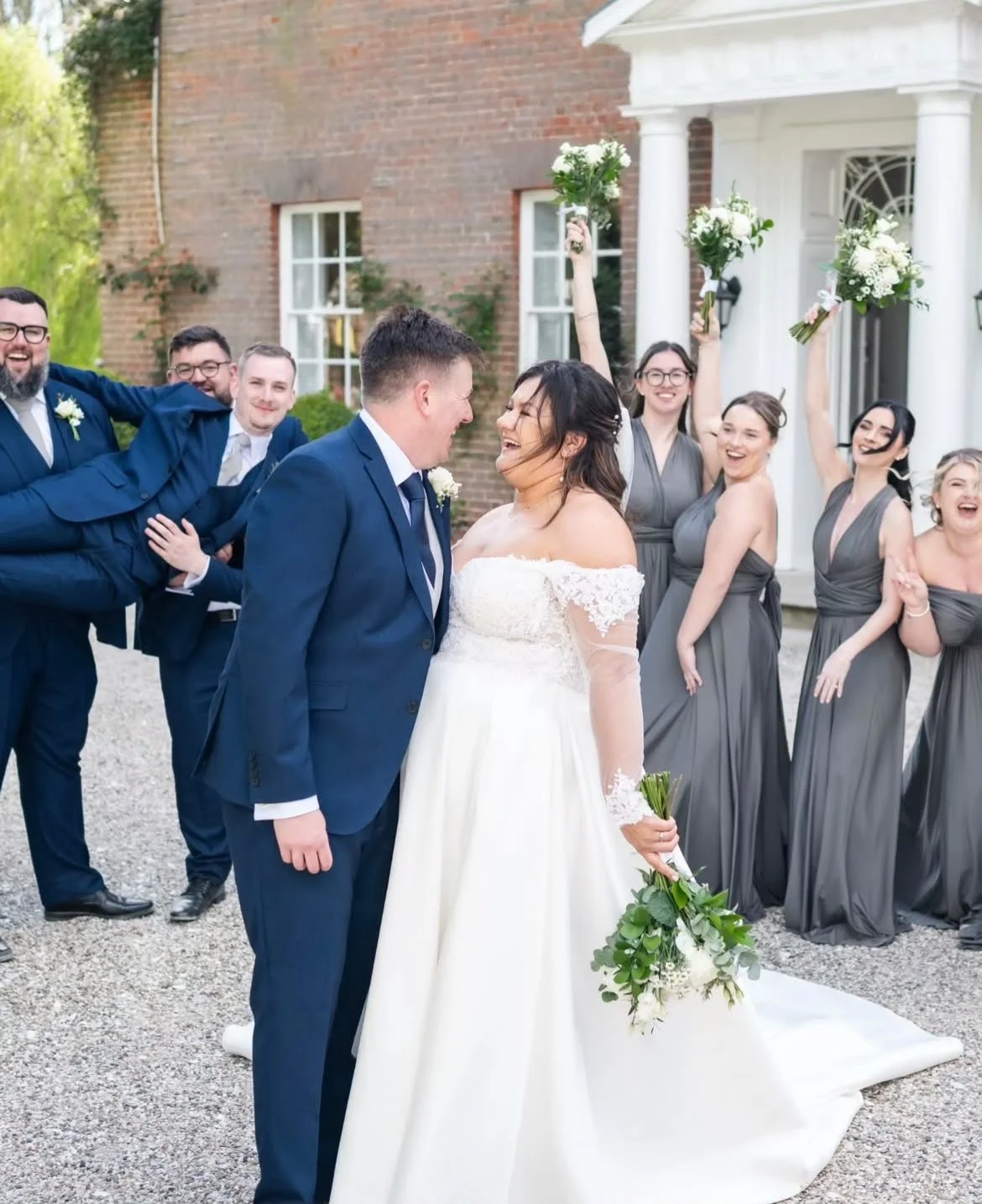 Couple smiling at Mulberry House, wedding venue in Essex, post wedding ceremony, created and delivered by Surrey wedding celebrant, who creates and delivers personal wedding ceremonies across the South East  Photo: Eyebrow Photography