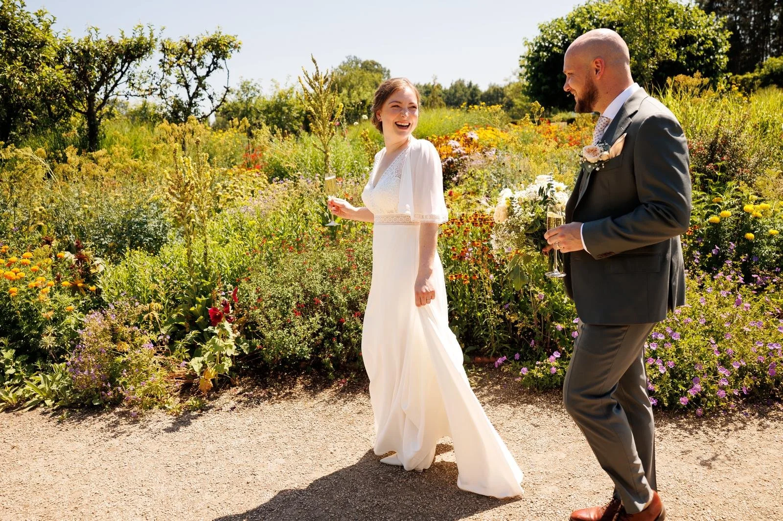 Wedding couple at Surrey wedding venue, Losely Park in Guildford following their personal, relaxed and heartfelt wedding ceremony by Surrey Wedding Celebrant. Photo: Laura Ellen Photo