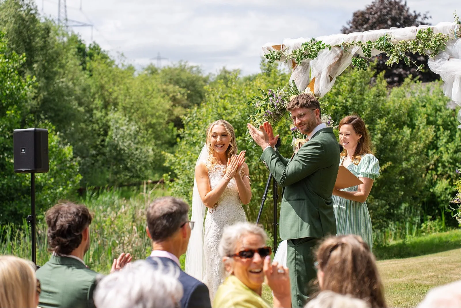 Wedding couple during their wedding ceremony by Surrey Wedding Celebrant. Photo: Soulful Reflections