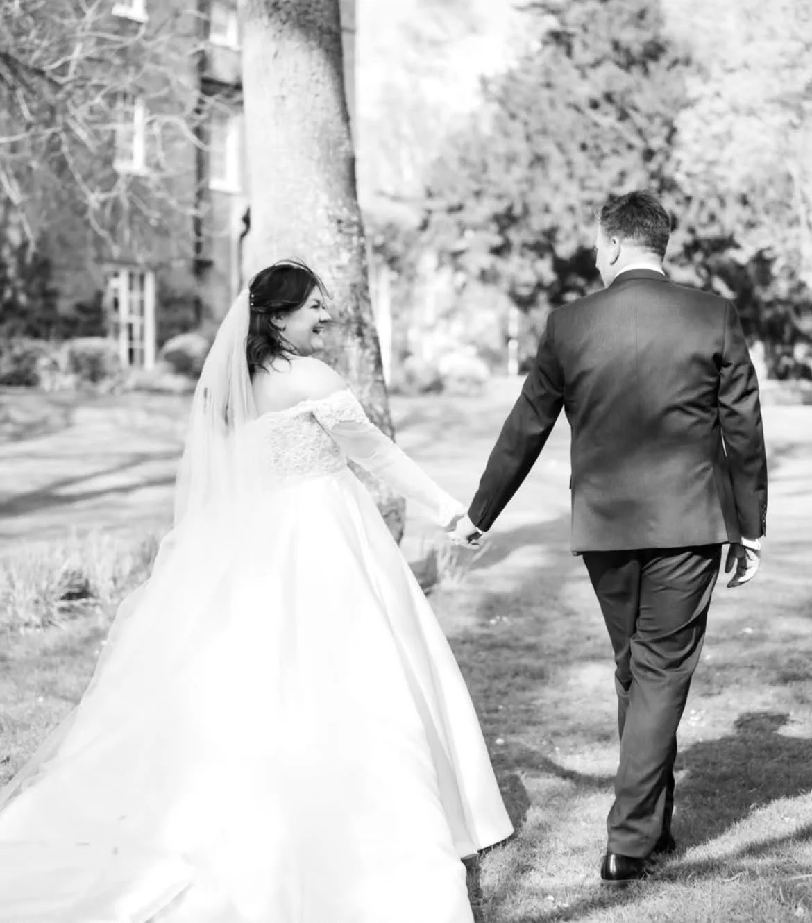 Couple at Mulberry House, wedding venue in Essex, post wedding ceremony, created and delivered by Surrey wedding celebrant,  who creates and delivers personal wedding ceremonies across the South East, Photo: Eyebrow Photography
