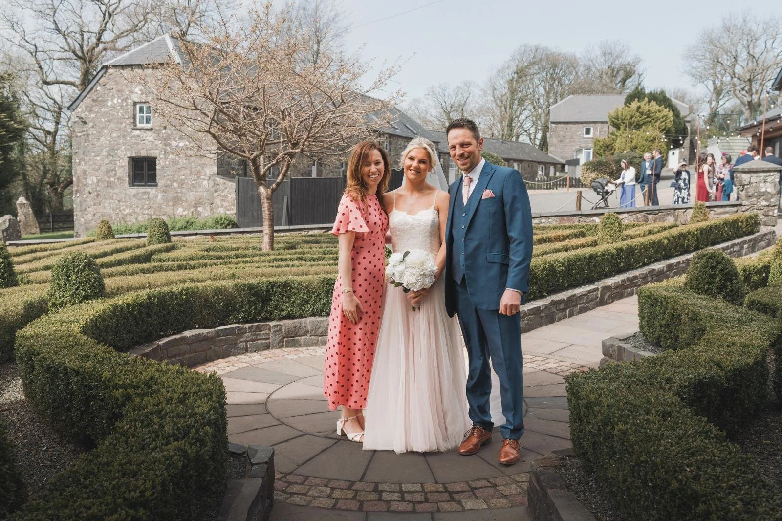 Newlywed couple with their independent Surrey based wedding celebrant. Photo: Browne & Dixon Photography