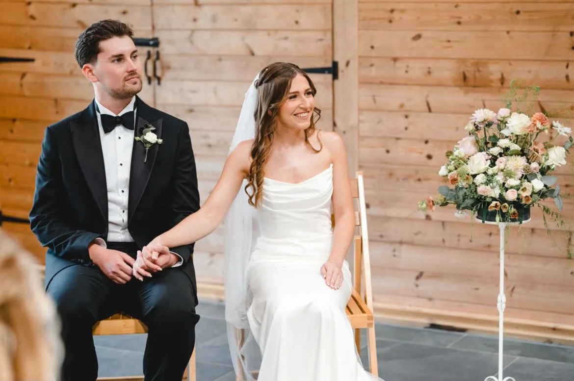 A smiling couple during their personalised wedding ceremony by a Surrey based wedding celebrant at Chafford Park, Kent. Photo: Parkershots