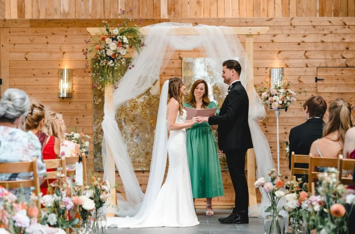 A beautiful couple exchanging rings during their personalised wedding ceremony led by an independent wedding celebrant creating and delivering personal ceremonies in Surrey, Kent and the South East. Photo: Parkershots