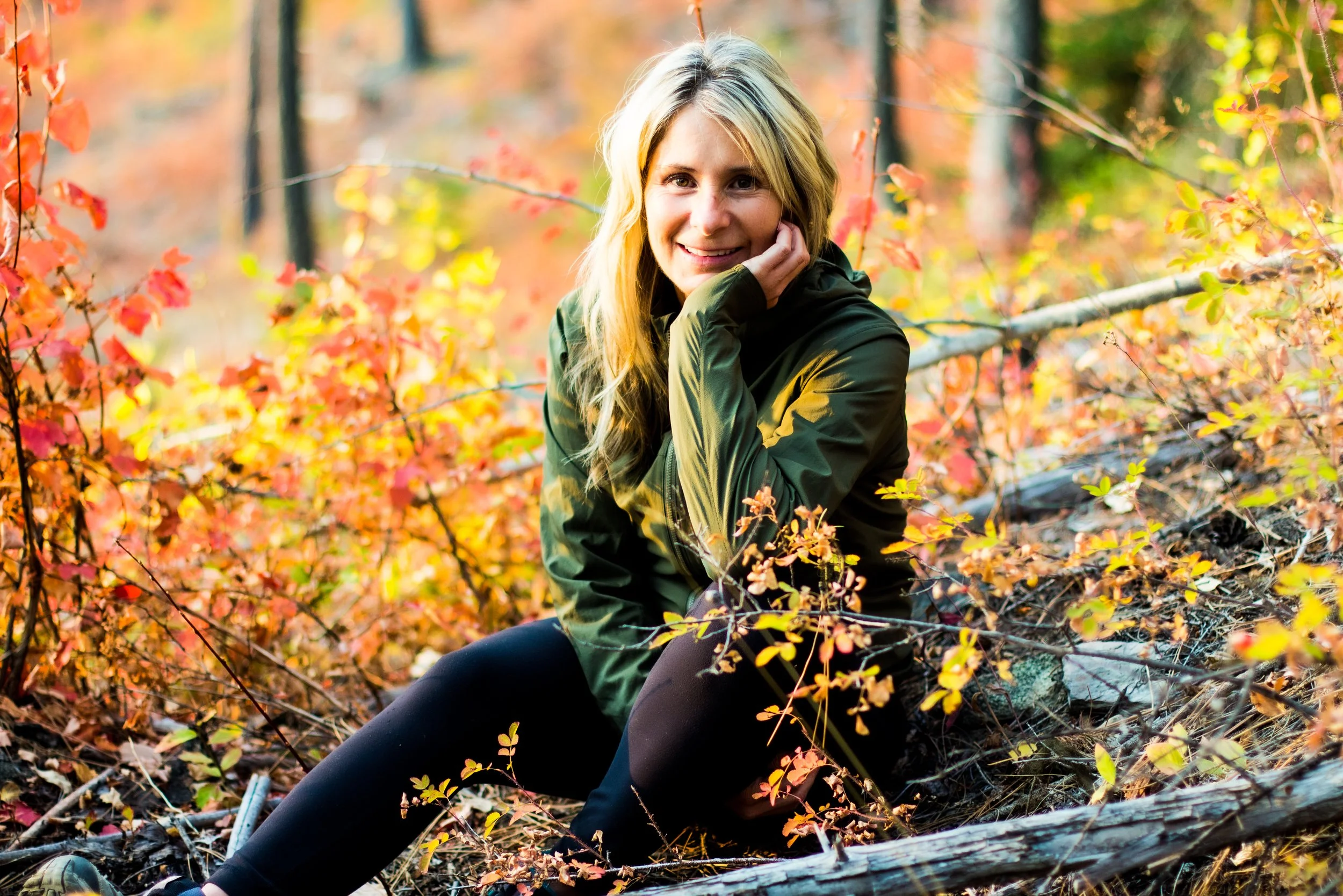 Candi sitting in autumn leaves