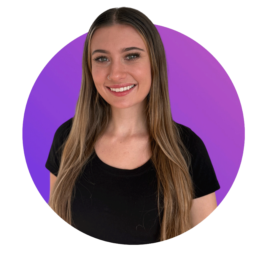 A smiling woman with long light brown hair, wearing a black t-shirt, against a purple background.