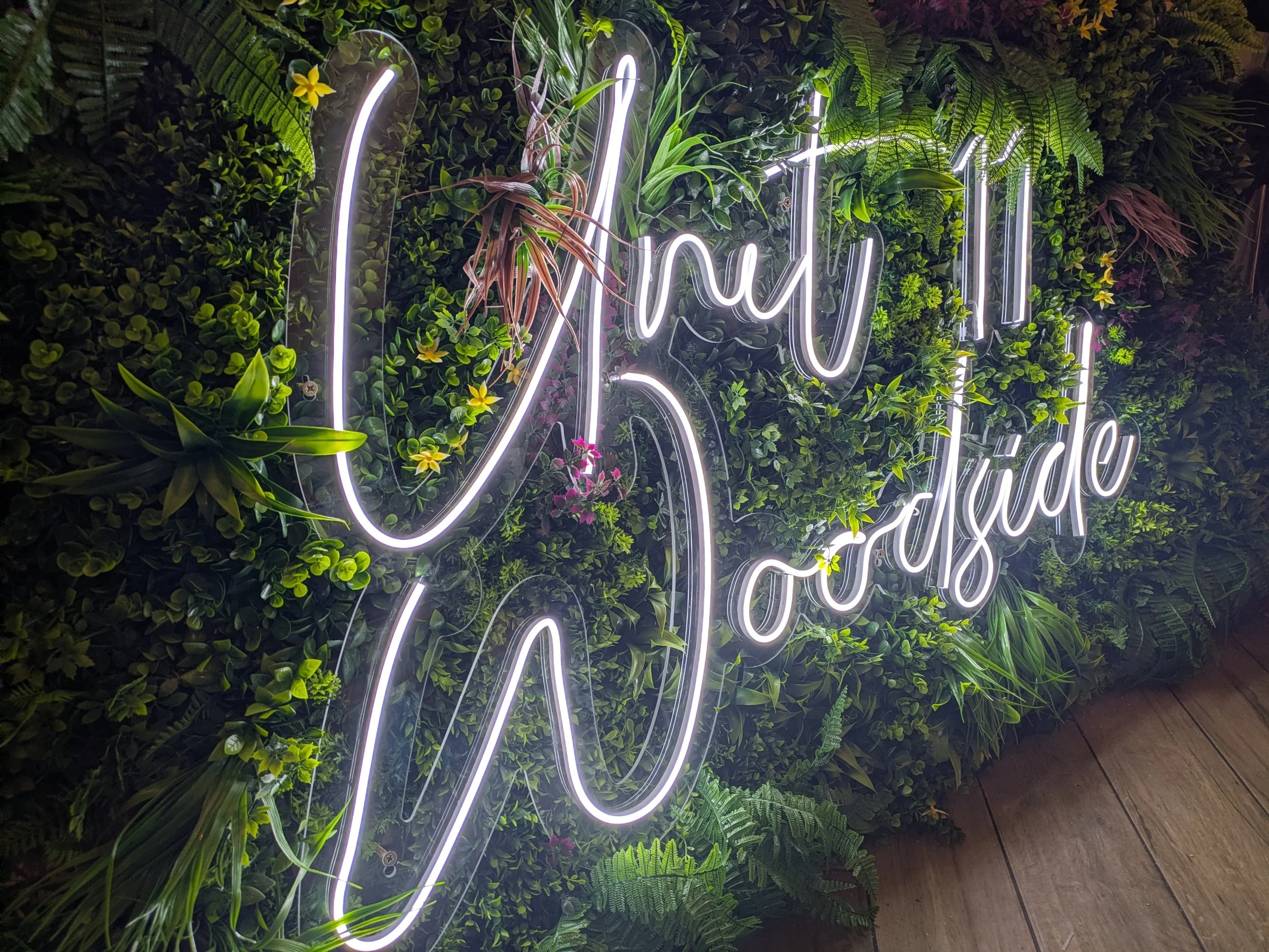 Led Faux Neon Sign with faux foliage back drop