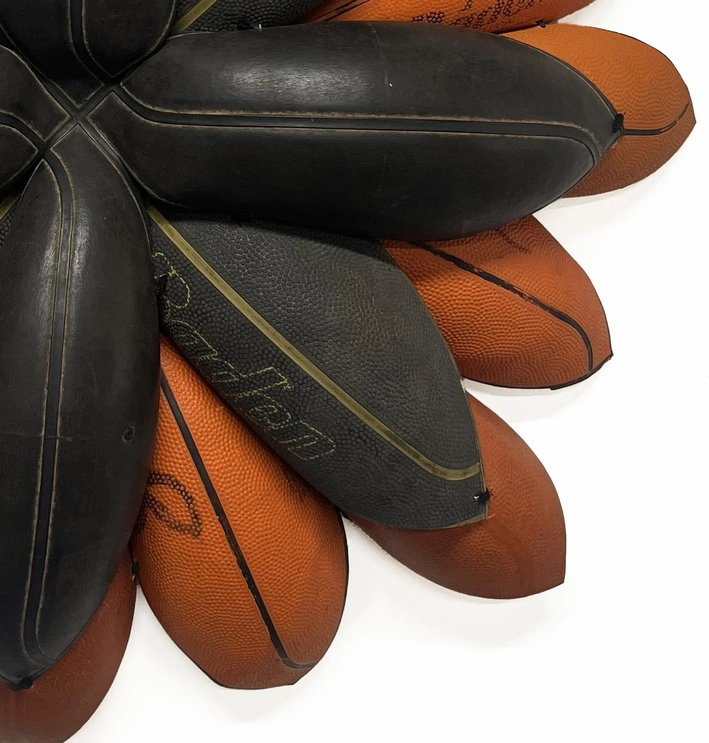 BRANDON J. DONAHUE-SHIPP- Basketball Bloom (Slick Baden)_Searched for and found basketballs, shoestrings_31x31x5_inches_2025.jpg