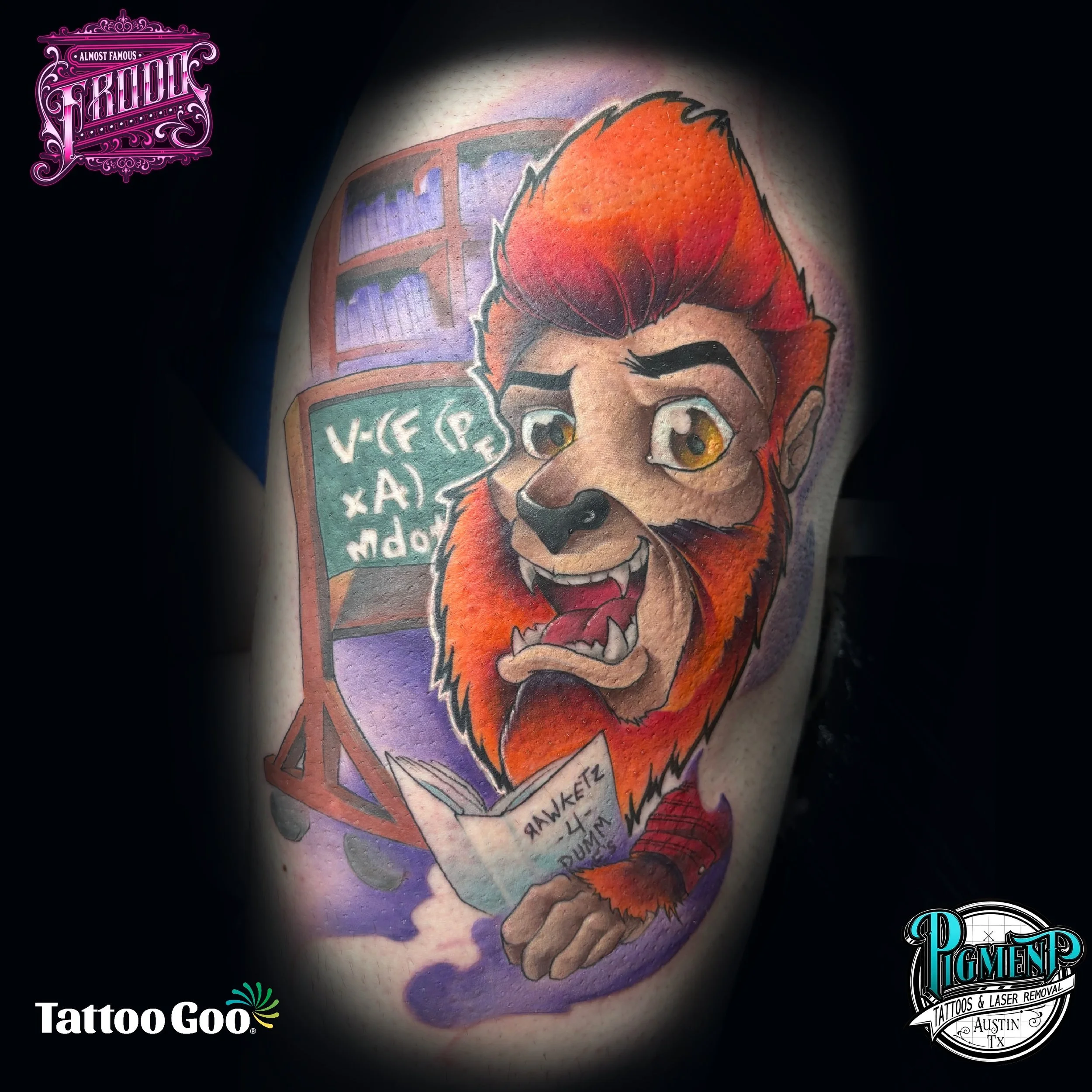 A colorful tattoo featuring a grinning wolf's face with orange and red fur, and big, expressive eyes. The background has purple and blue tones resembling clouds or sky. Some text is visible but partially obscured, with the legible part reading 'Tattoos & Laser Removal Austin TX.'