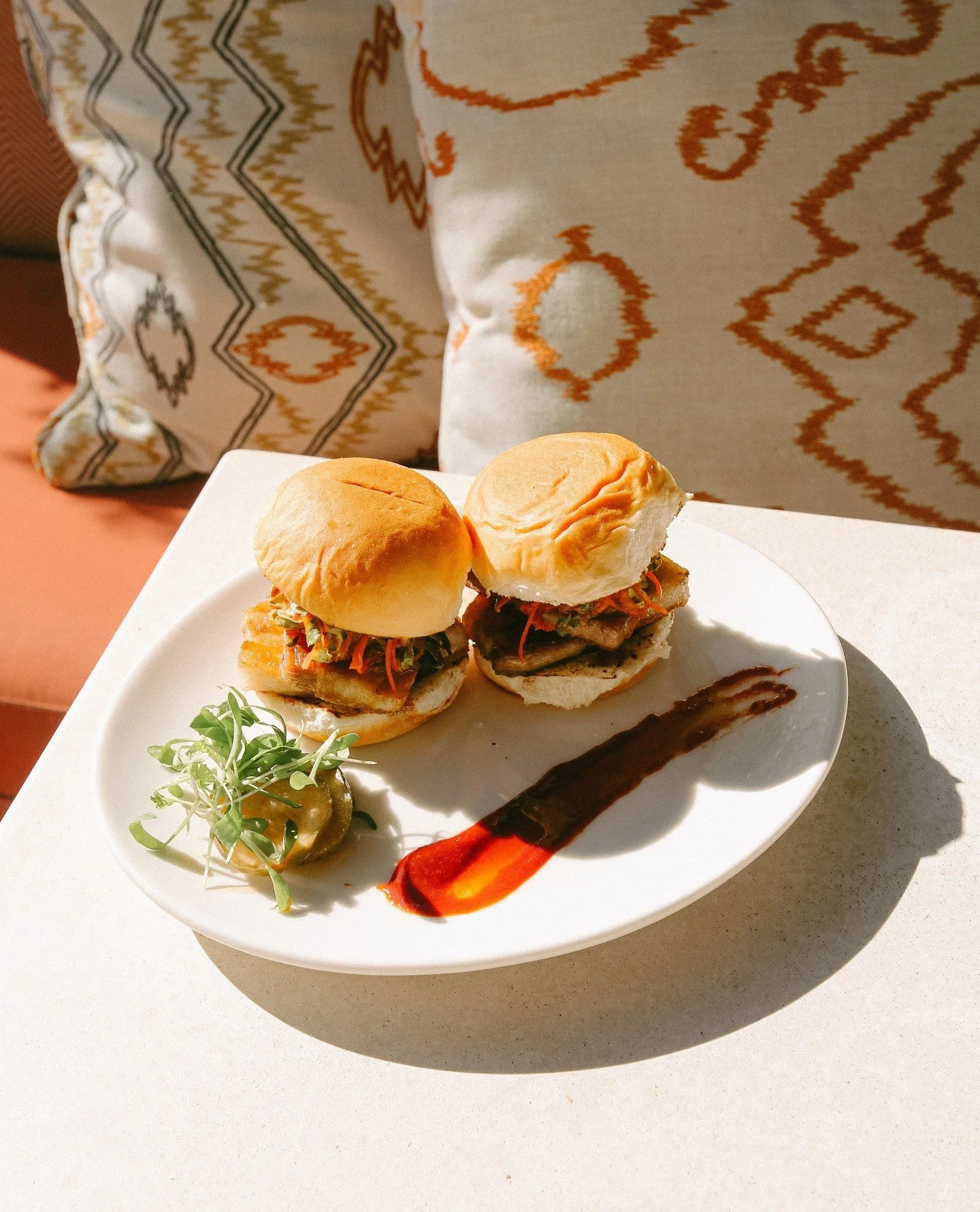 New at Norman: soy-glazed pork belly sliders with kimchi slaw on Hawaiian rolls. Slide through. ⁠