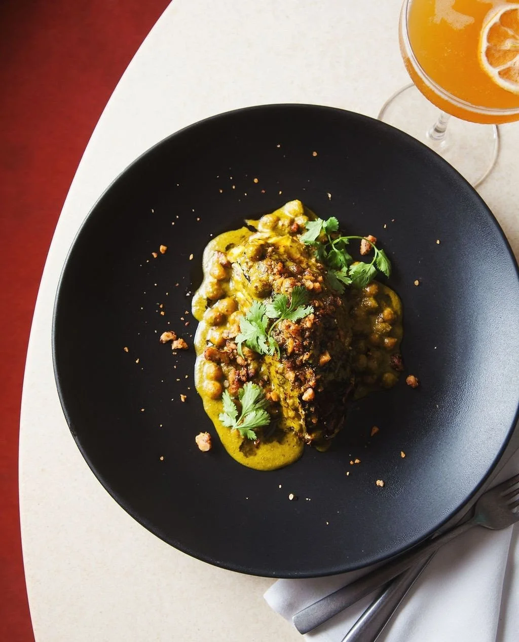 ⁠Green coconut curry over braised cabbage with spiced walnuts and roasted chickpeas.⁠ Available nightly at Norman. ⁠
⁠
.⁠
.⁠
.⁠
⁠
Photos: @jenjoi