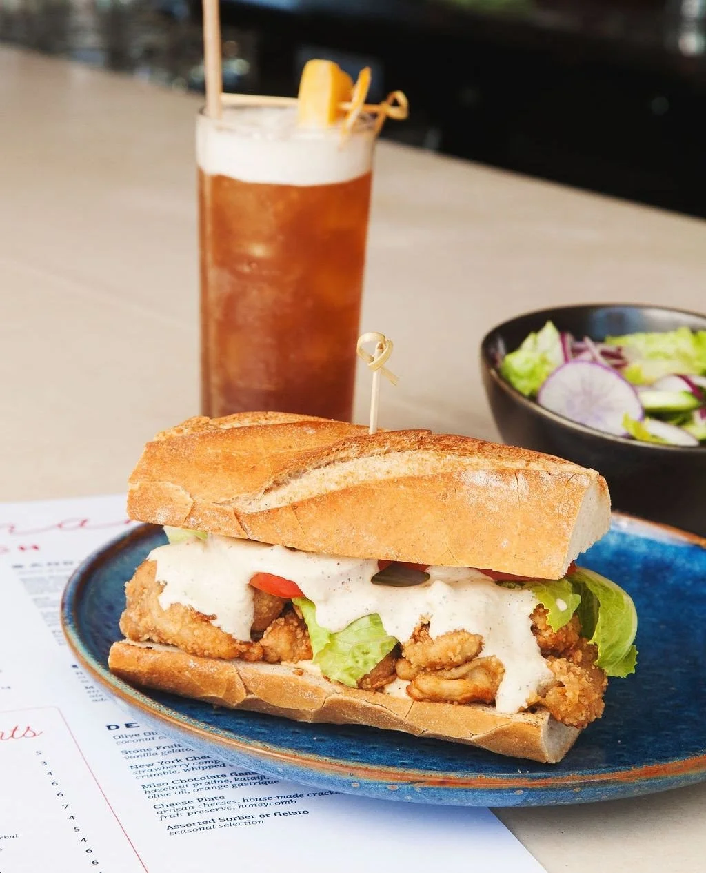 The Po&rsquo; Boy went vegan. Norman's take on the classic features tempura @mightycapmushrooms, heirloom tomato, and Cajun remoulade on a @backporchbakerycafe baguette. ⁠
⁠
Find it on the lunch menu, served Mondays-Fridays, 12 to 3pm. ⁠
⁠
.⁠
.⁠
.⁠
⁠