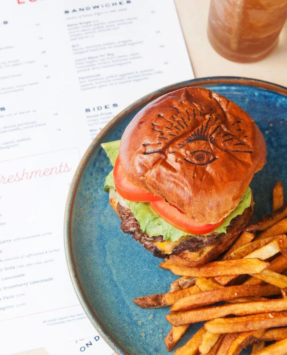 Chef Tyler has put his stamp on a Norman classic. The Bates Burger 2.0 comes stacked with double smash patties, secret sauce, American cheese, grilled onion, heirloom tomato, and lettuce on brioche, with house-cut fries. ⁠
⁠
.⁠
.⁠
.⁠
⁠
Photo: @jenjoi