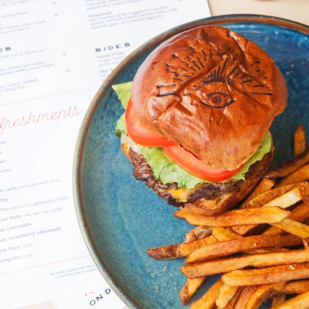 Norman lunch menu featuring drinks, salads, starters, and sandwiches in Los Alamos.