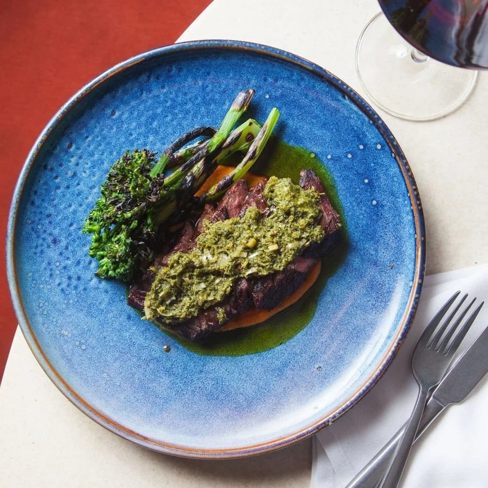 A fresh dinner menu at Norman in los Alamos, featuring nourishing meals, tasty starters, and fresh summer salads.