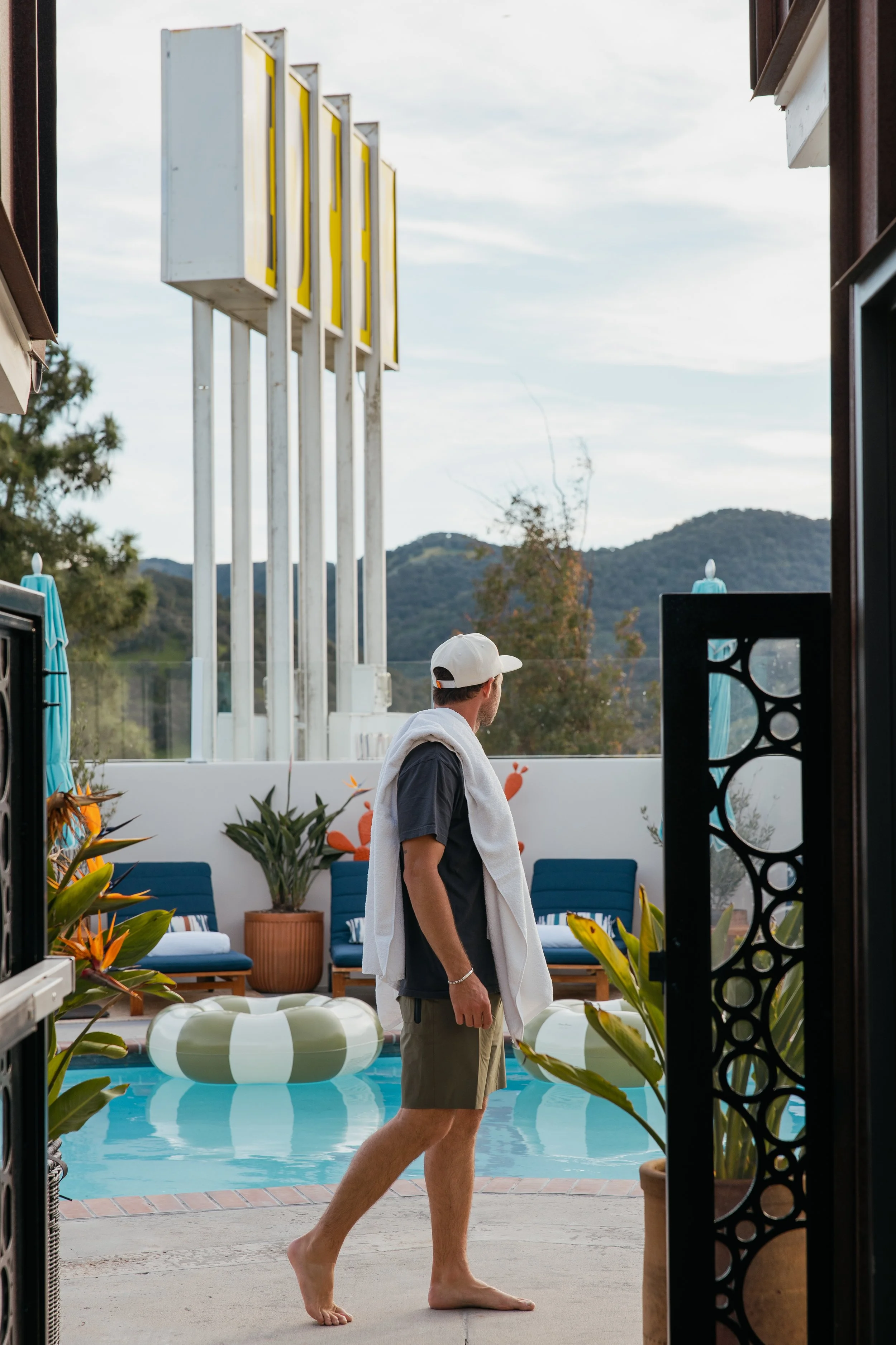 Guests relaxing at Skyview Los Alamos heated pool day pass experience