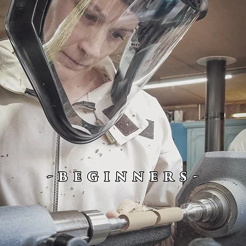Lady turning a pen on a lathe