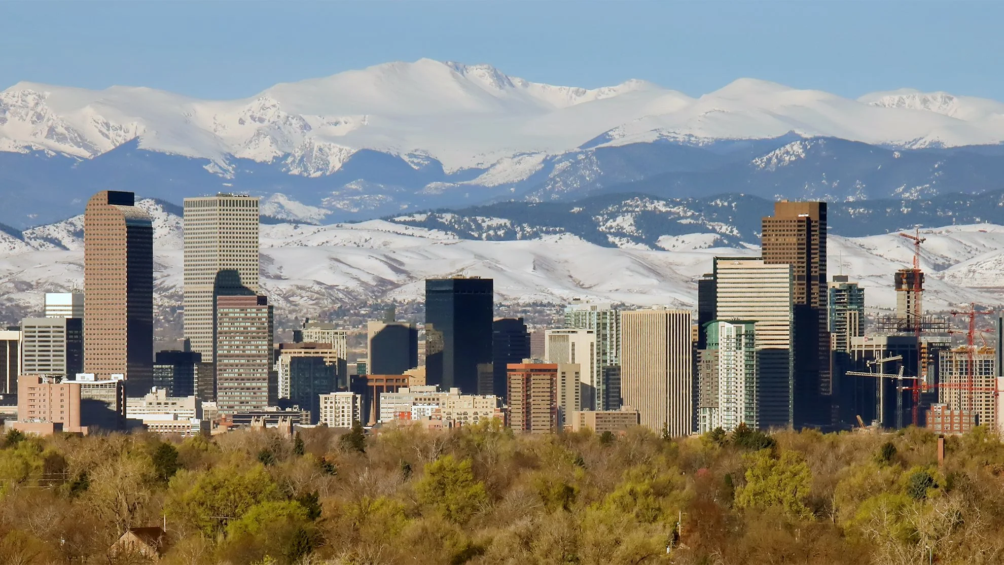 City of Denver, Colorado surrounded by snowy mountains in winter