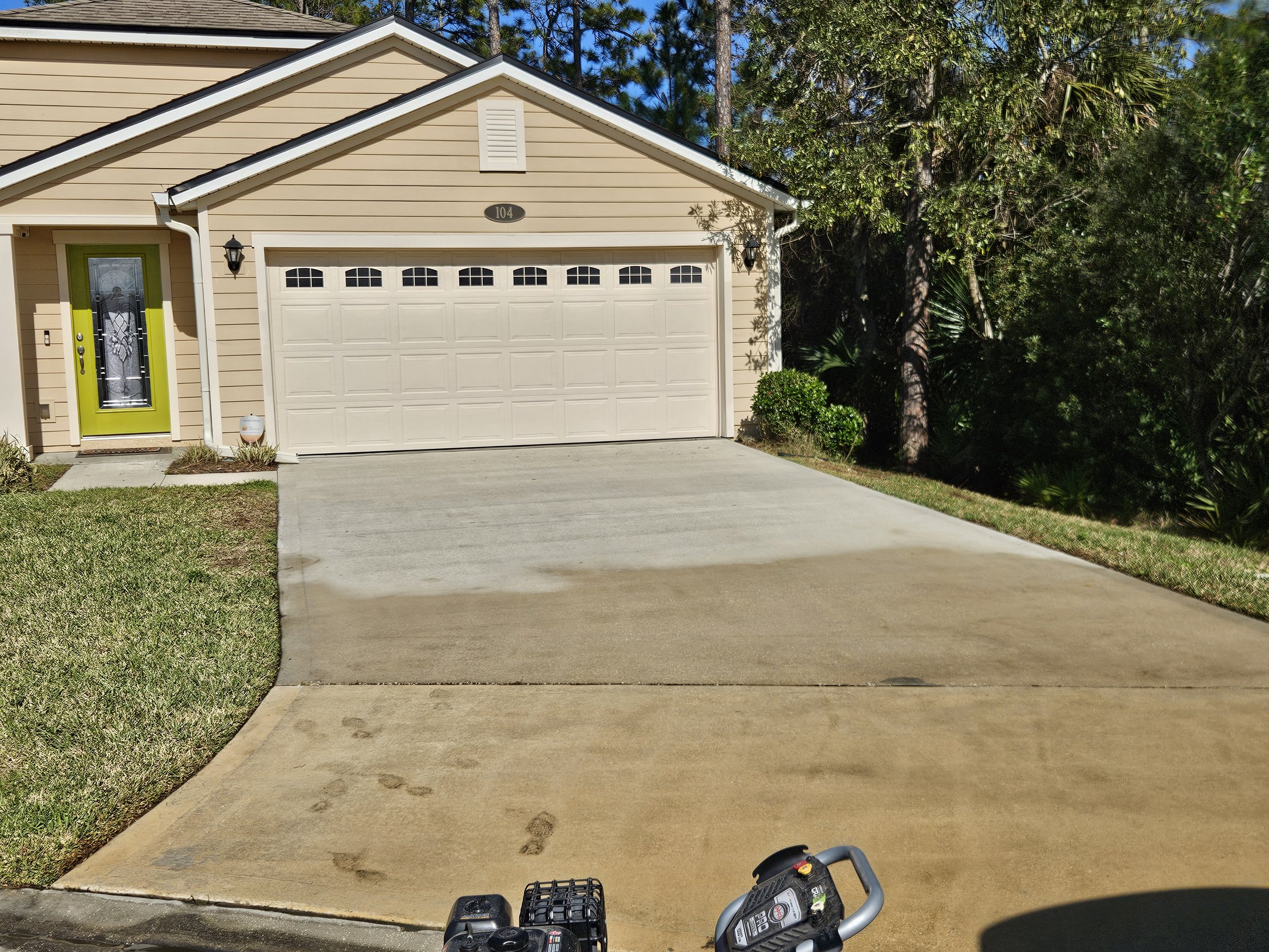 Palm Coast home after we pressure washed the driveway.