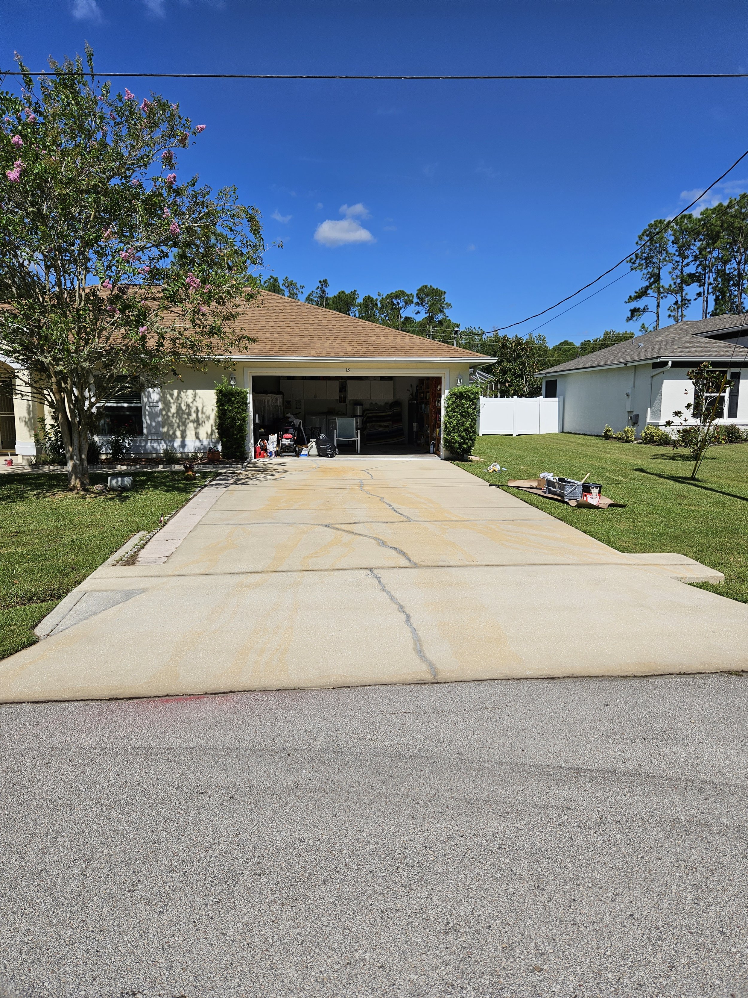 Palm Coast home before we pressure washed and painted the driveway.